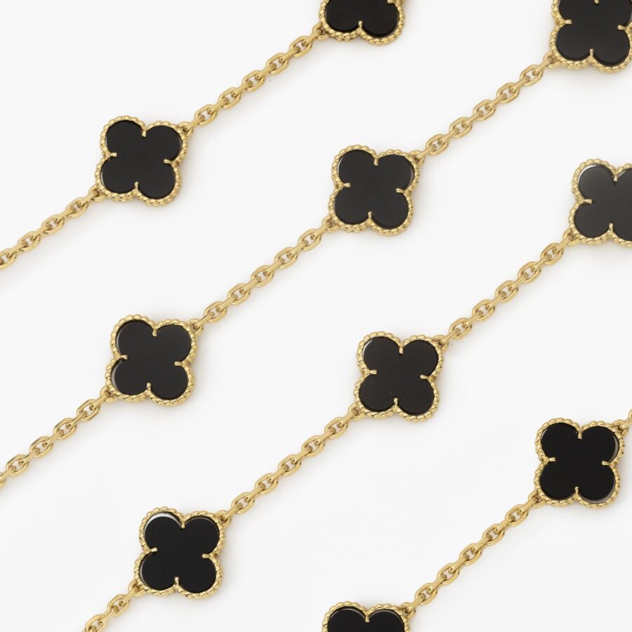 An eighteen carat yellow gold “Alhambra” longchain set with onyx. Signed Van Cleef & Arpels, and numbered. Made in Paris, ca 1970.