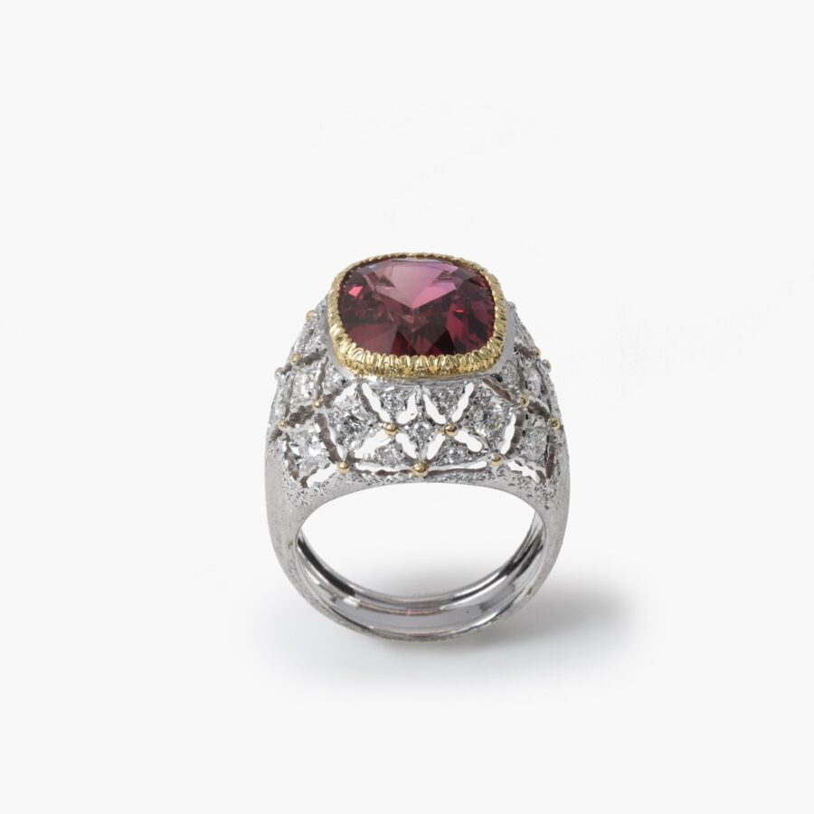 An eighteen carat white and yellow gold ring set with a orange-pink tourmaline and brilliant cut diamonds. Signed M. Buccellati, made in Milan, ca 1965.