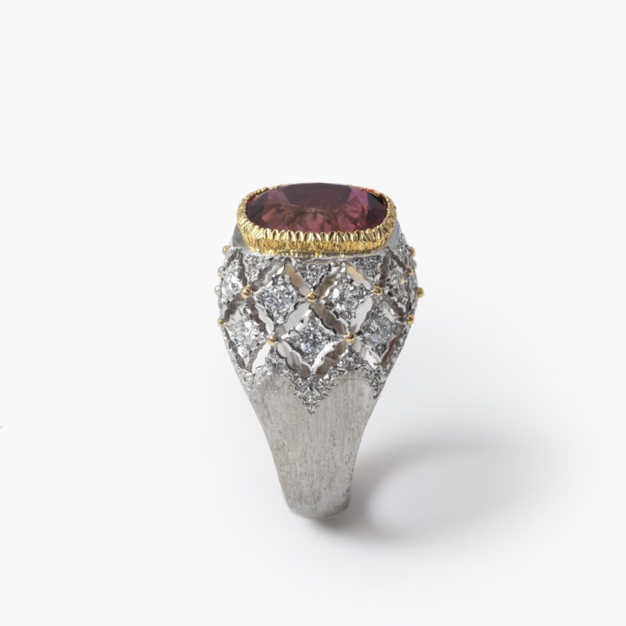 An eighteen carat white and yellow gold ring set with a orange-pink tourmaline and brilliant cut diamonds. Signed M. Buccellati, made in Milan, ca 1965.