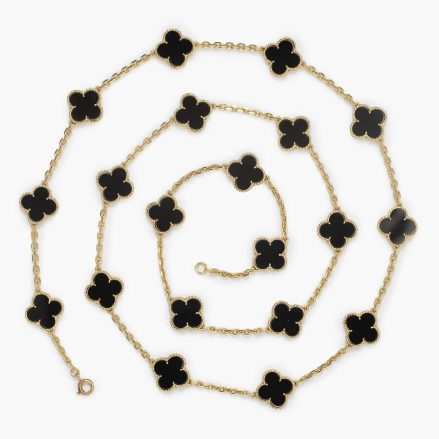 An eighteen carat yellow gold “Alhambra” longchain set with onyx. Signed Van Cleef & Arpels, and numbered. Made in Paris, ca 1970.