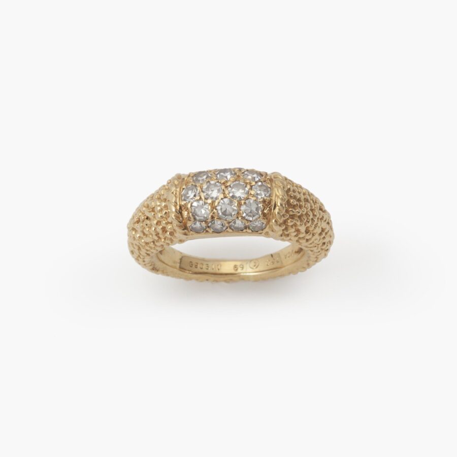 An eighteen carat yellow gold ring of bombé design “Philippine”, set with diamonds and with etched texture. Signed Van Cleef & Arpels, Paris, dated 1969.