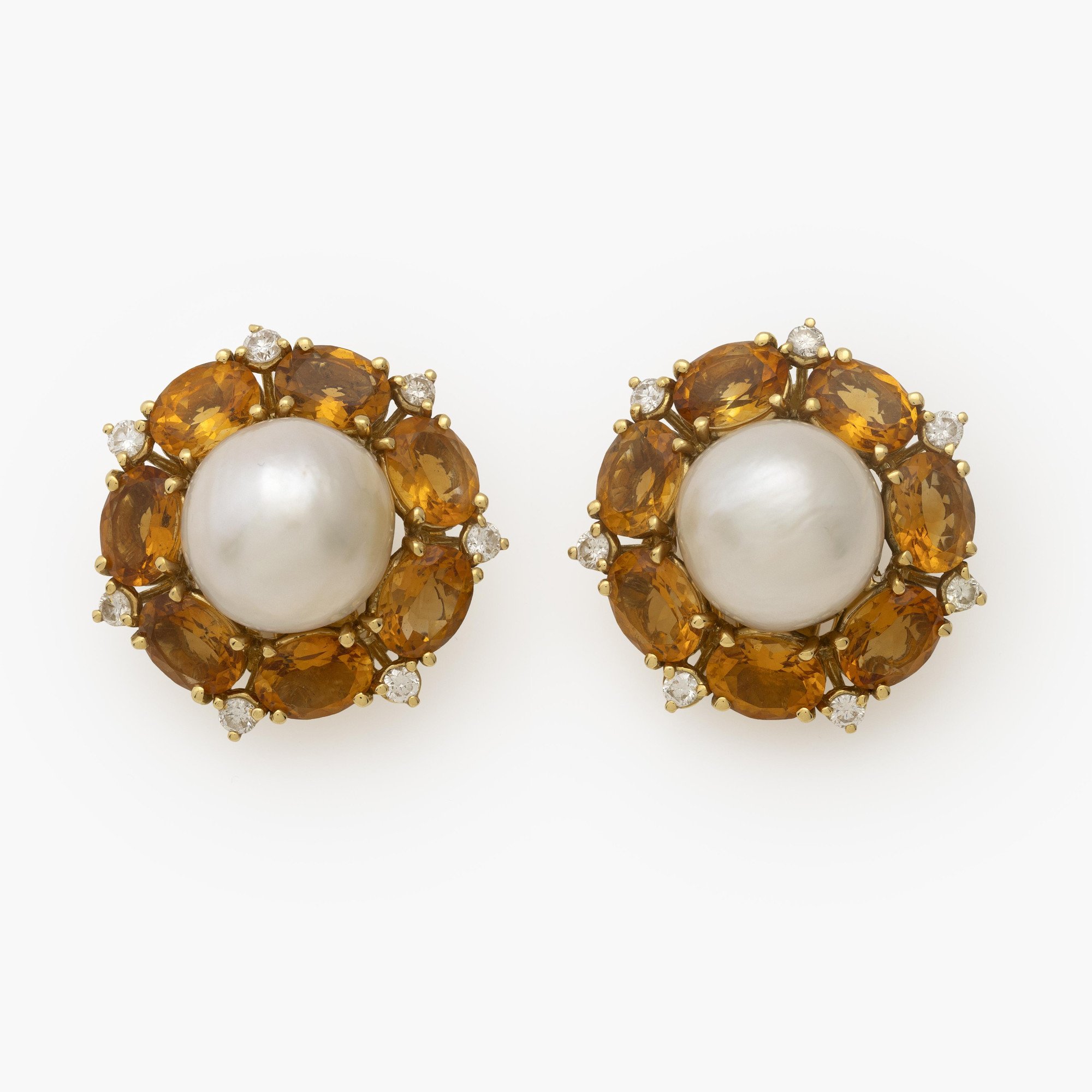 A pair of eighteen-carat yellow gold clip earrings, set with a South Sea pearl, citrines and diamonds. Signed Seaman Schepps, made in the USA.