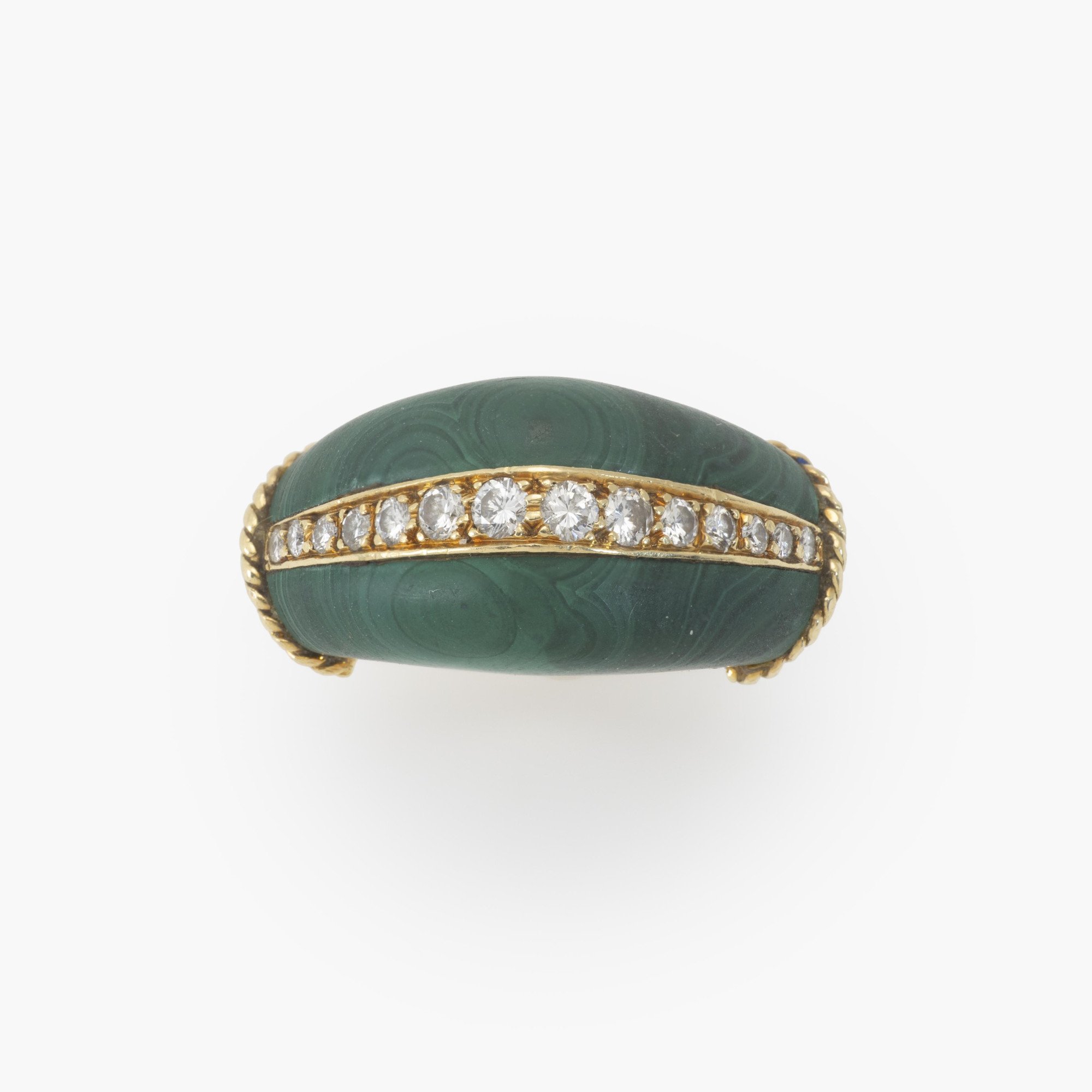 An eighteen-karat yellow gold ring set with malachite and brilliant-cut diamonds. Signed Cartier and numbered, made in Paris, circa 1980.