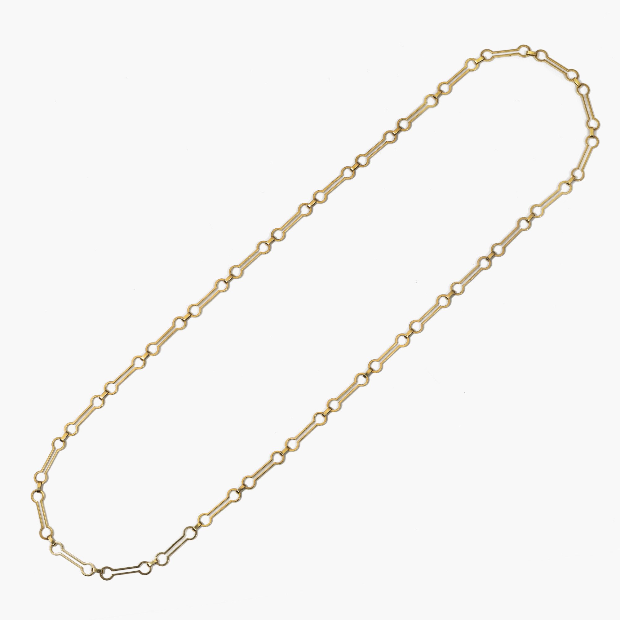 An eighteen-karat yellow gold sautoir composed of open links, without a clasp. Signed P. Cardin, made in Paris, ca 1960.