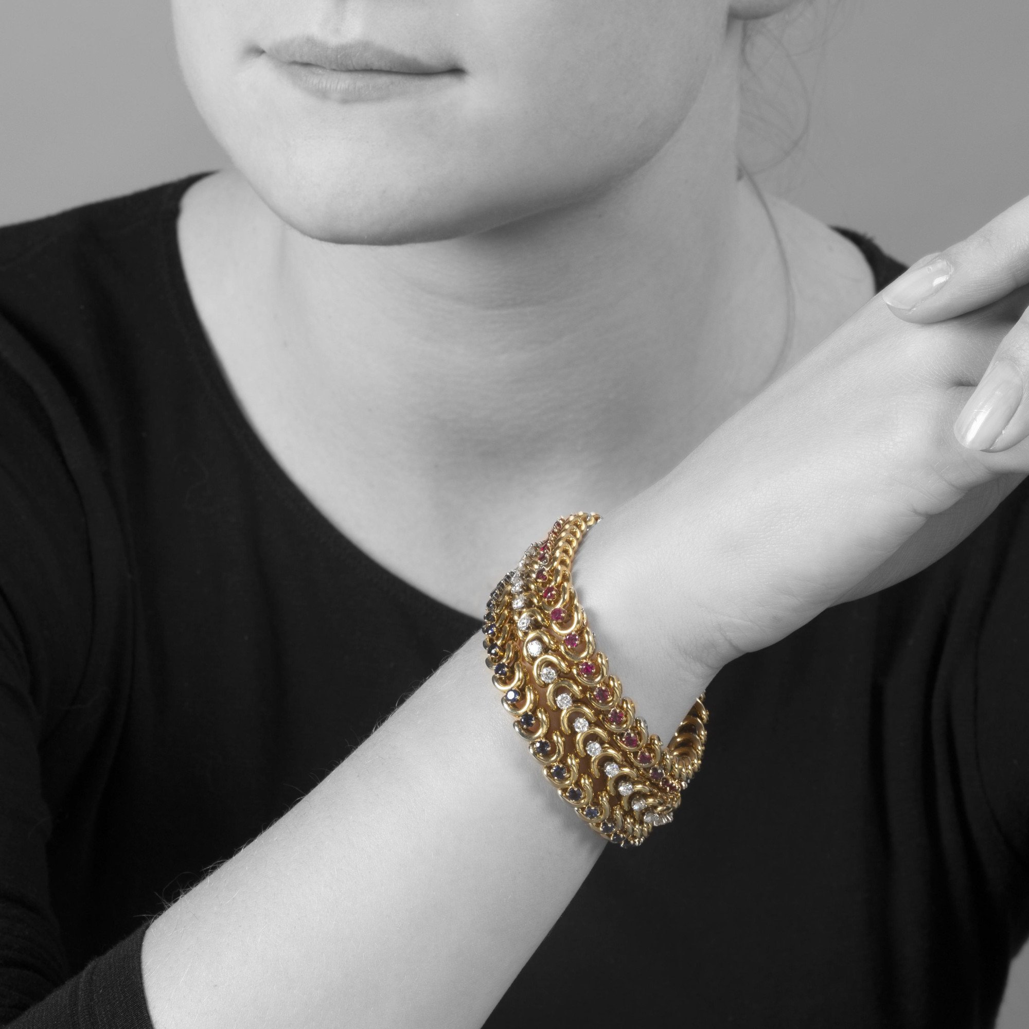 A set of three identical eighteen-carat yellow gold bracelets, set with sapphires, diamonds and rubies. Van Cleef & Arpels, New York, with original box.