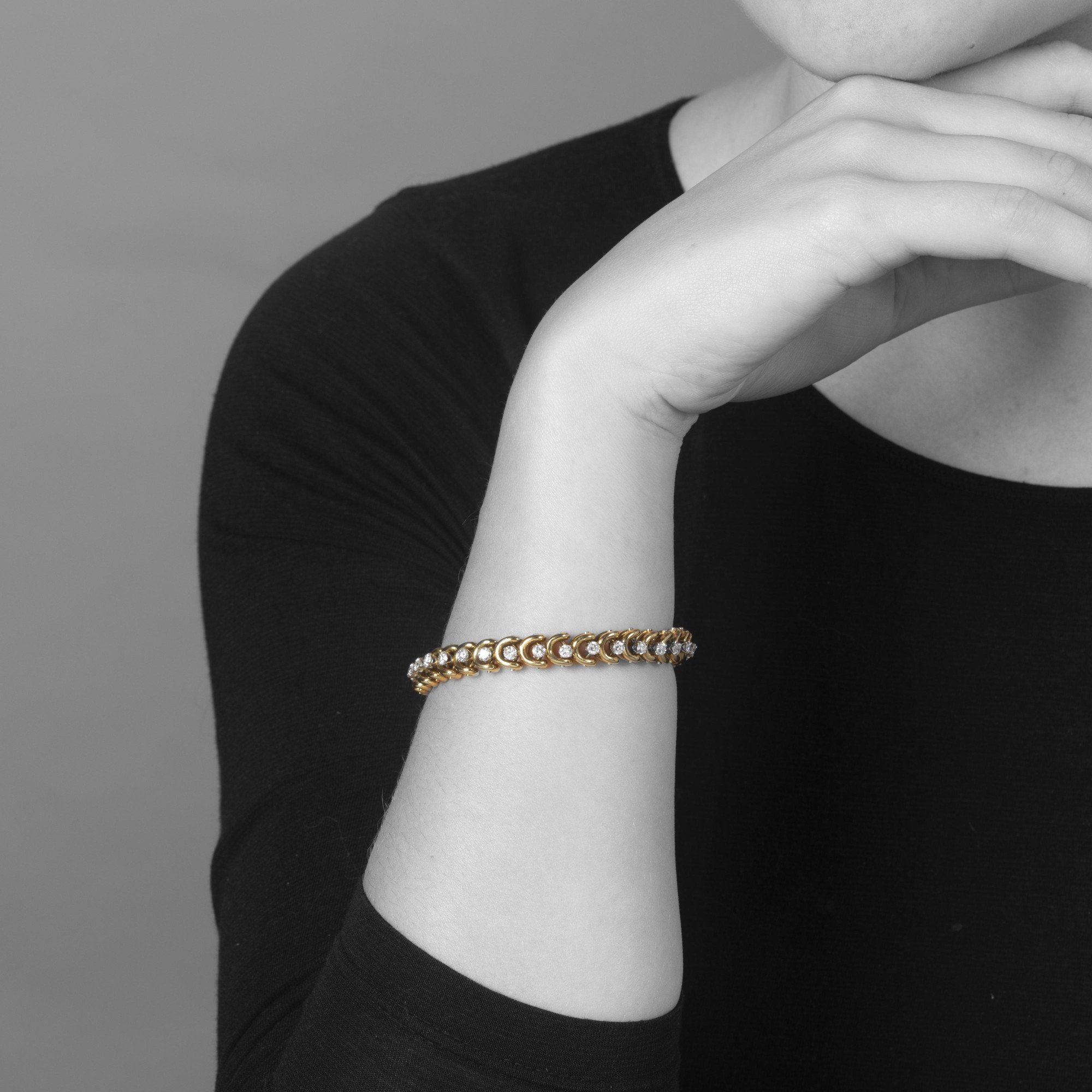 A set of three identical eighteen-carat yellow gold bracelets, set with sapphires, diamonds and rubies. Van Cleef & Arpels, New York, with original box.