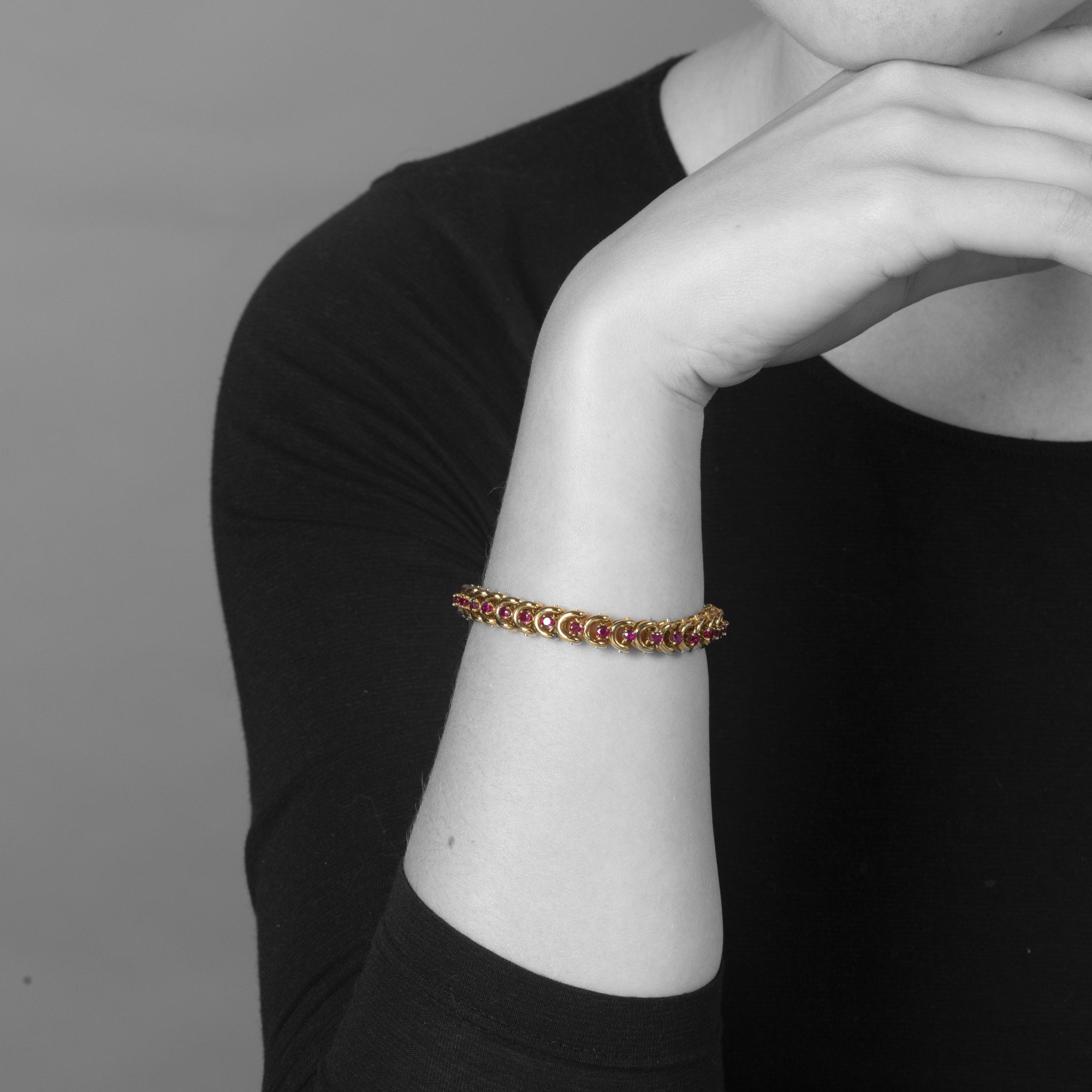 A set of three identical eighteen-carat yellow gold bracelets, set with sapphires, diamonds and rubies. Van Cleef & Arpels, New York, with original box.