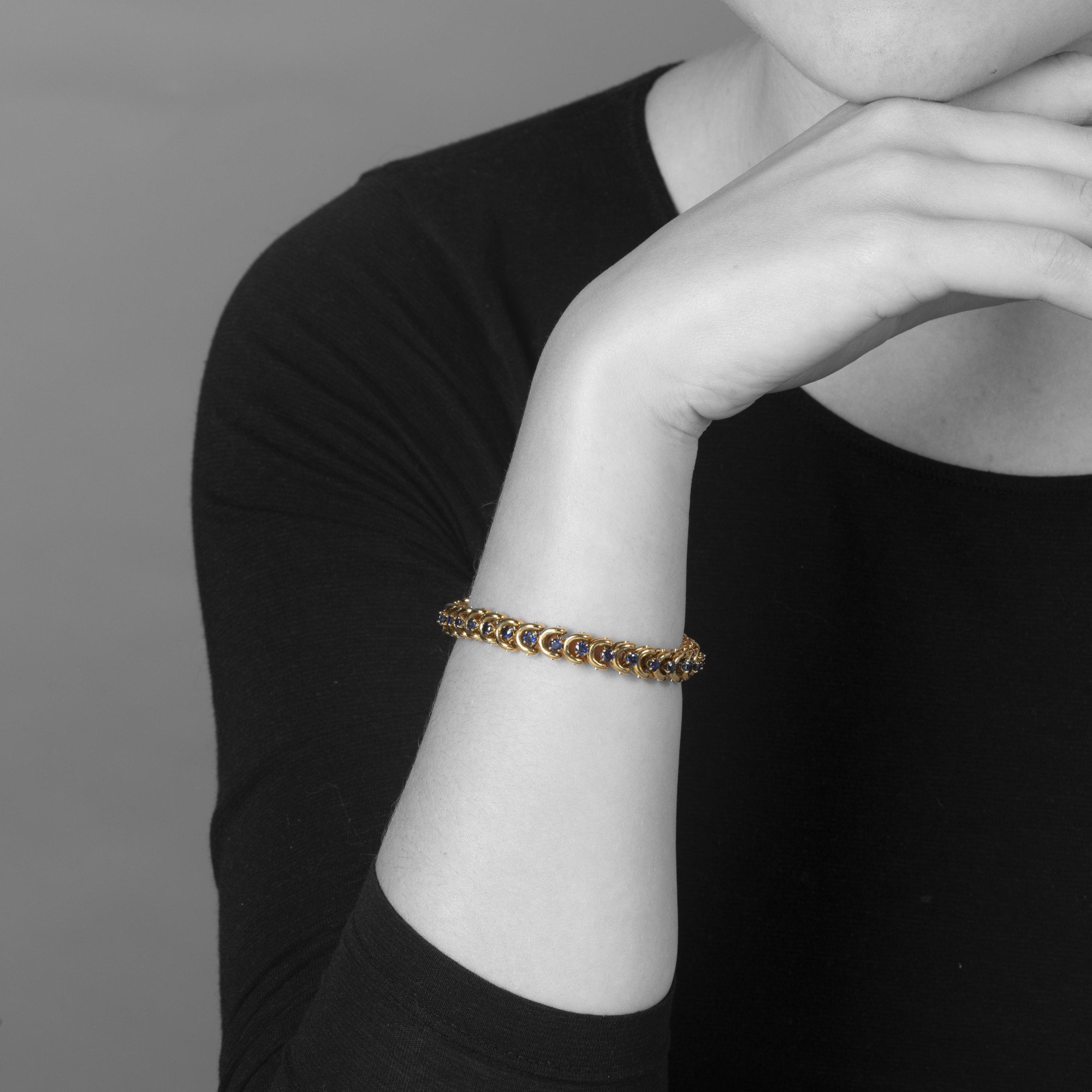 A set of three identical eighteen-carat yellow gold bracelets, set with sapphires, diamonds and rubies. Van Cleef & Arpels, New York, with original box.