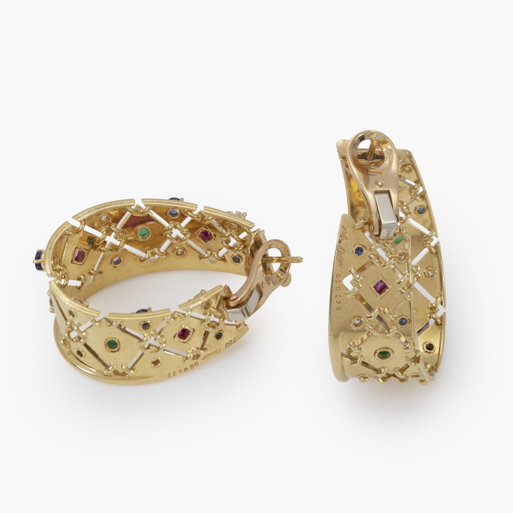 A pair of eighteen-carat yellow gold ´Liberty´ earrings, set with diamond, sapphire, ruby and emerald. Signed Cartier, made in Paris, circa 1980.
