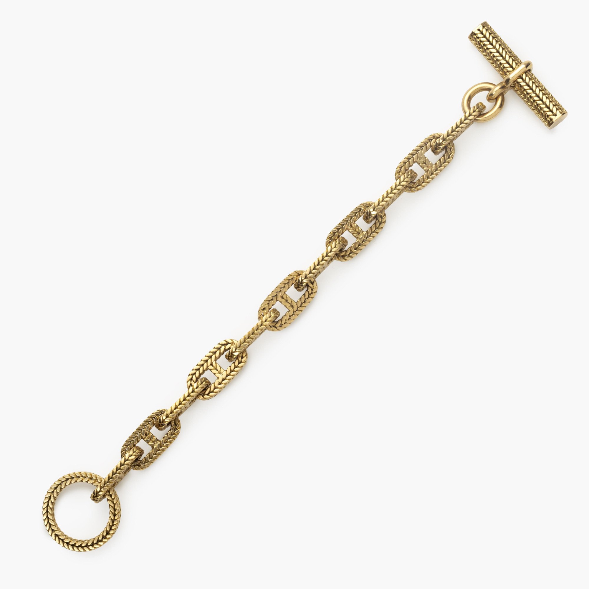 An eighteen carat yellow gold “Chaîne d’Ancre” bracelet. Signed Hermès Paris, numbered. Made by Georges Lenfant, Paris. With original case.