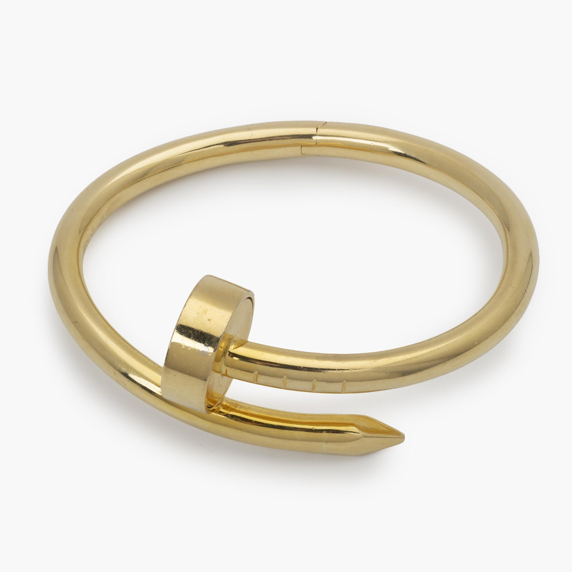 An eighteen-karat yellow gold “Juste un Clou” bracelet. Signed by Aldo Cipullo, dated 1971; the year in which the original design was launched.