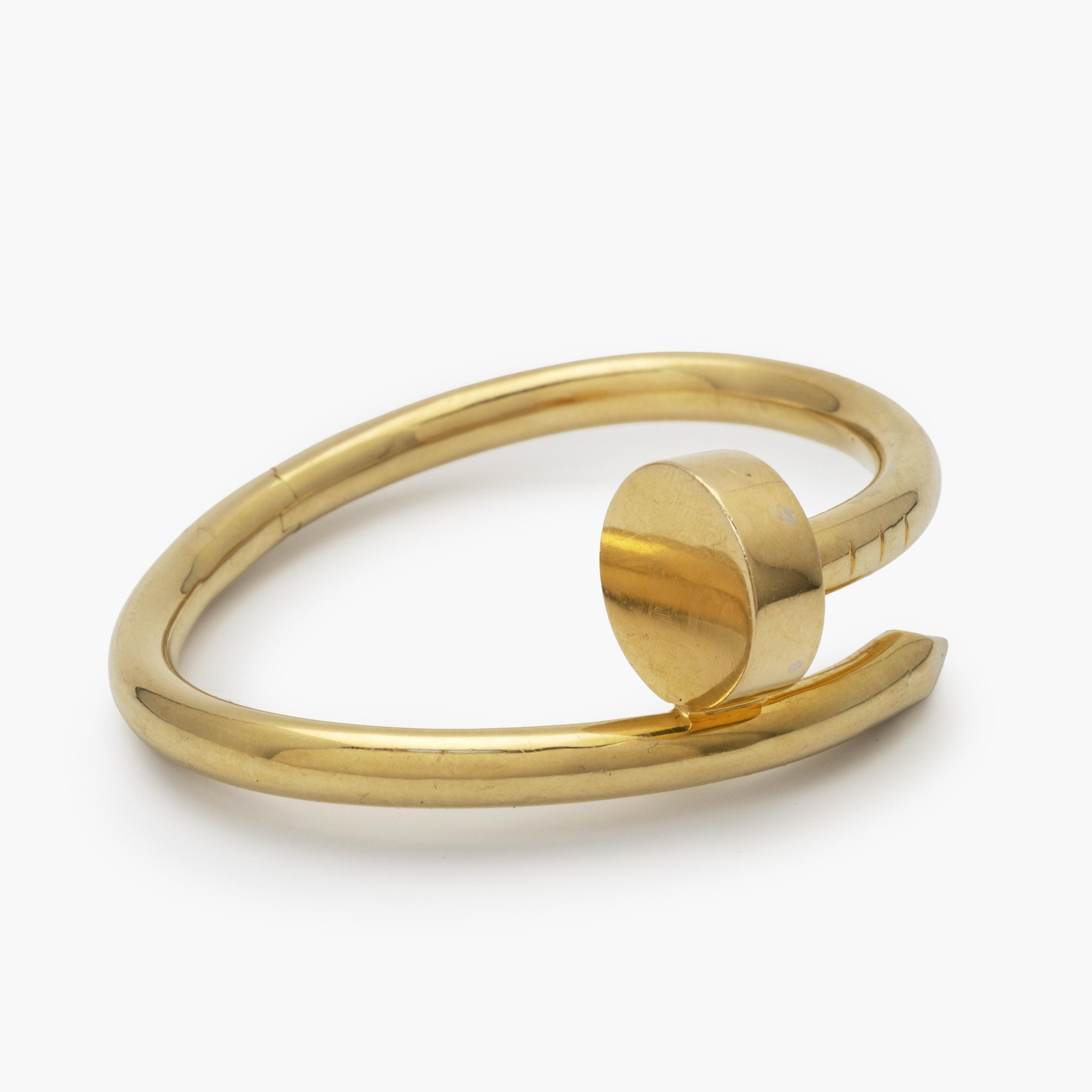 An eighteen-karat yellow gold “Juste un Clou” bracelet. Signed by Aldo Cipullo, dated 1971; the year in which the original design was launched.