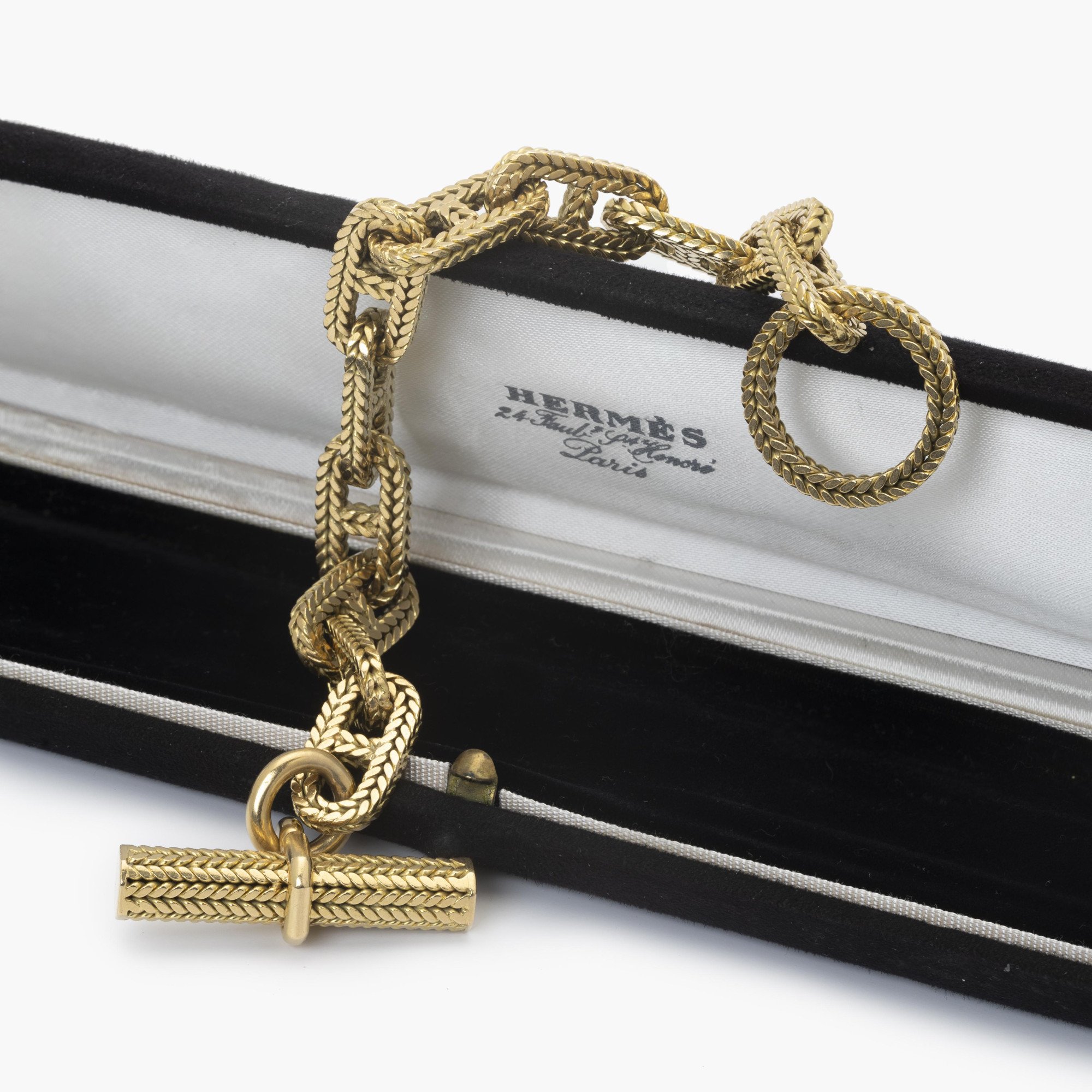 An eighteen carat yellow gold “Chaîne d’Ancre” bracelet. Signed Hermès Paris, numbered. Made by Georges Lenfant, Paris. With original case.