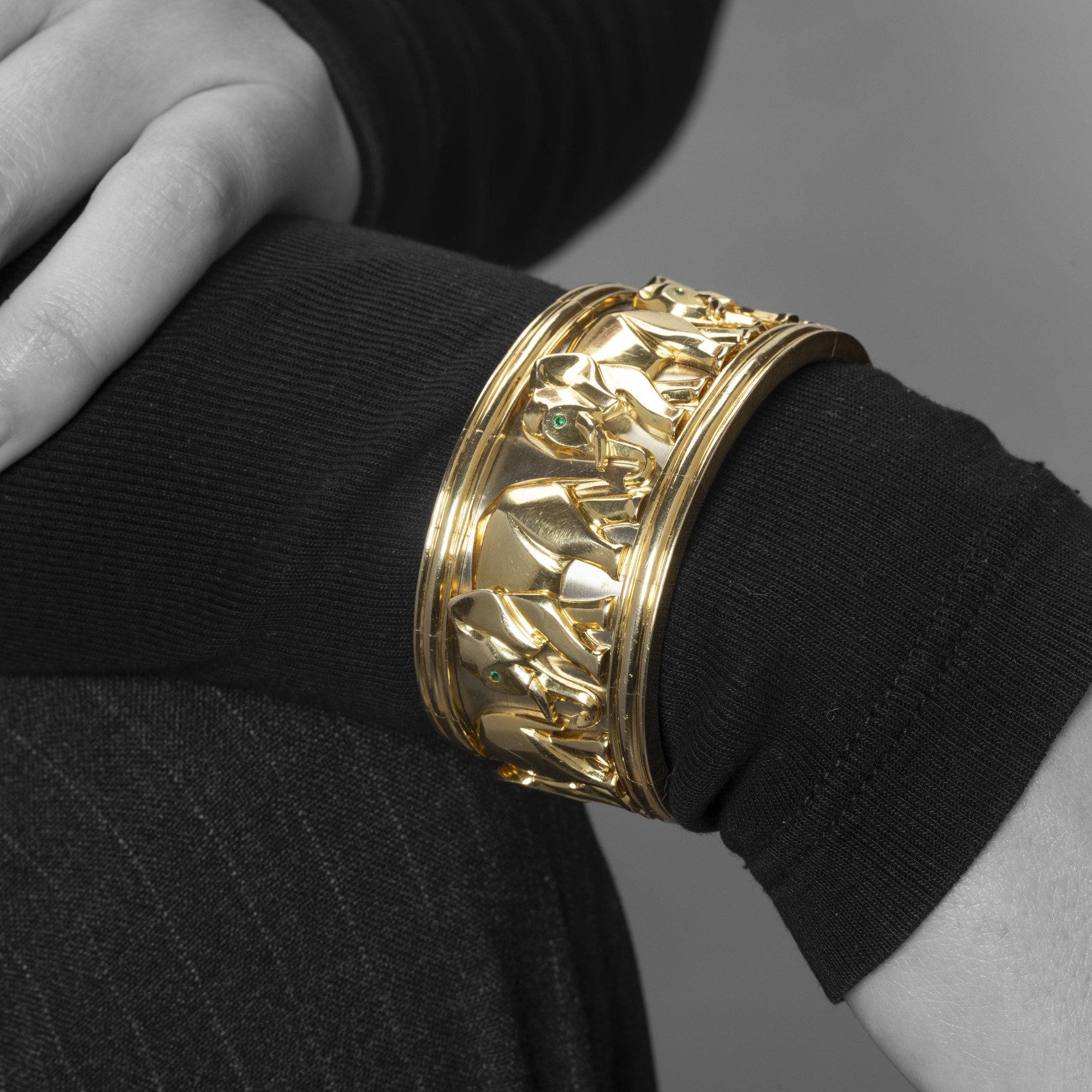 An eighteen-carat yellow and white gold “Djigar” cuff bracelet decorated with elephants. Signed Cartier, made in Paris in 1992, numbered. In original case.