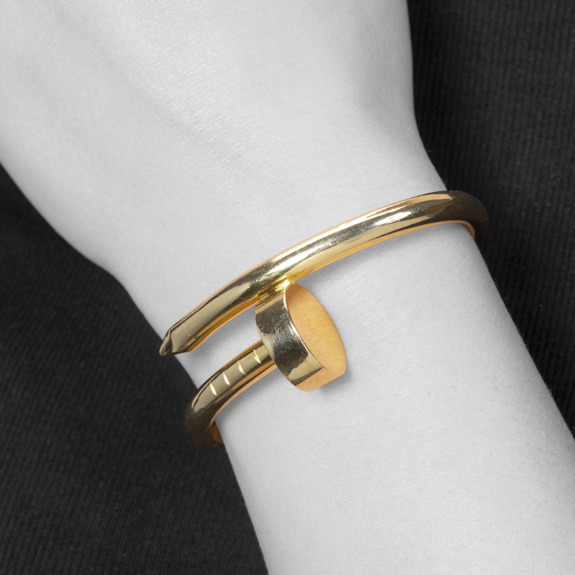 An eighteen-karat yellow gold “Juste un Clou” bracelet. Signed by Aldo Cipullo, dated 1971; the year in which the original design was launched.