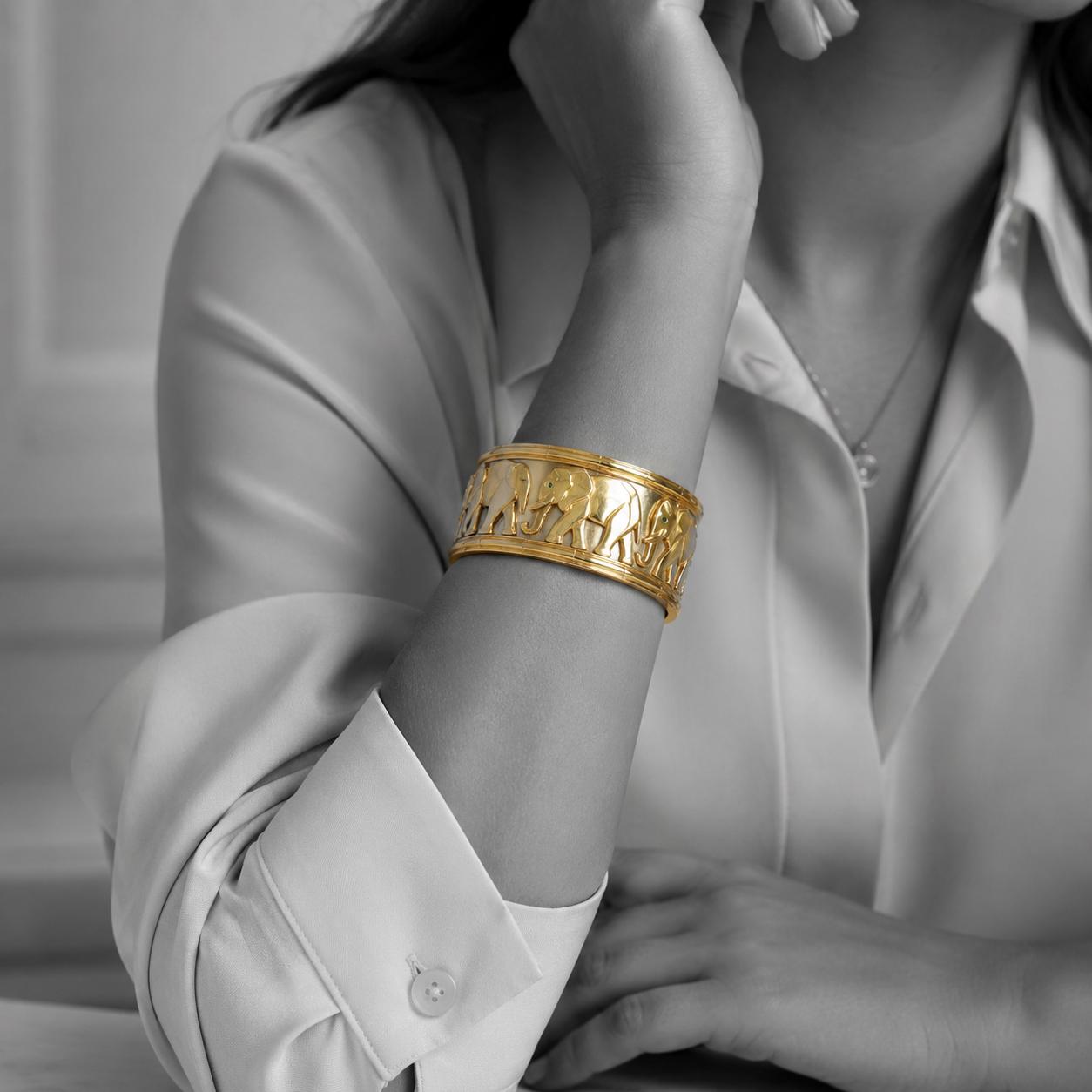 An eighteen-carat yellow and white gold “Djigar” cuff bracelet decorated with elephants. Signed Cartier, made in Paris in 1992, numbered. In original case.