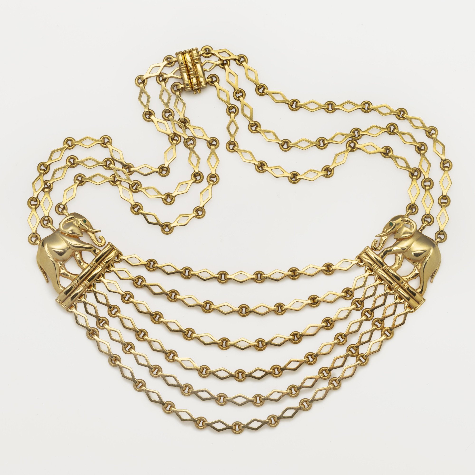 An eighteen carat yellow gold “Djigar” necklace, with two stylized elephants. Signed Cartier, Paris, circa 1995. Numbered and in original fold-over case.