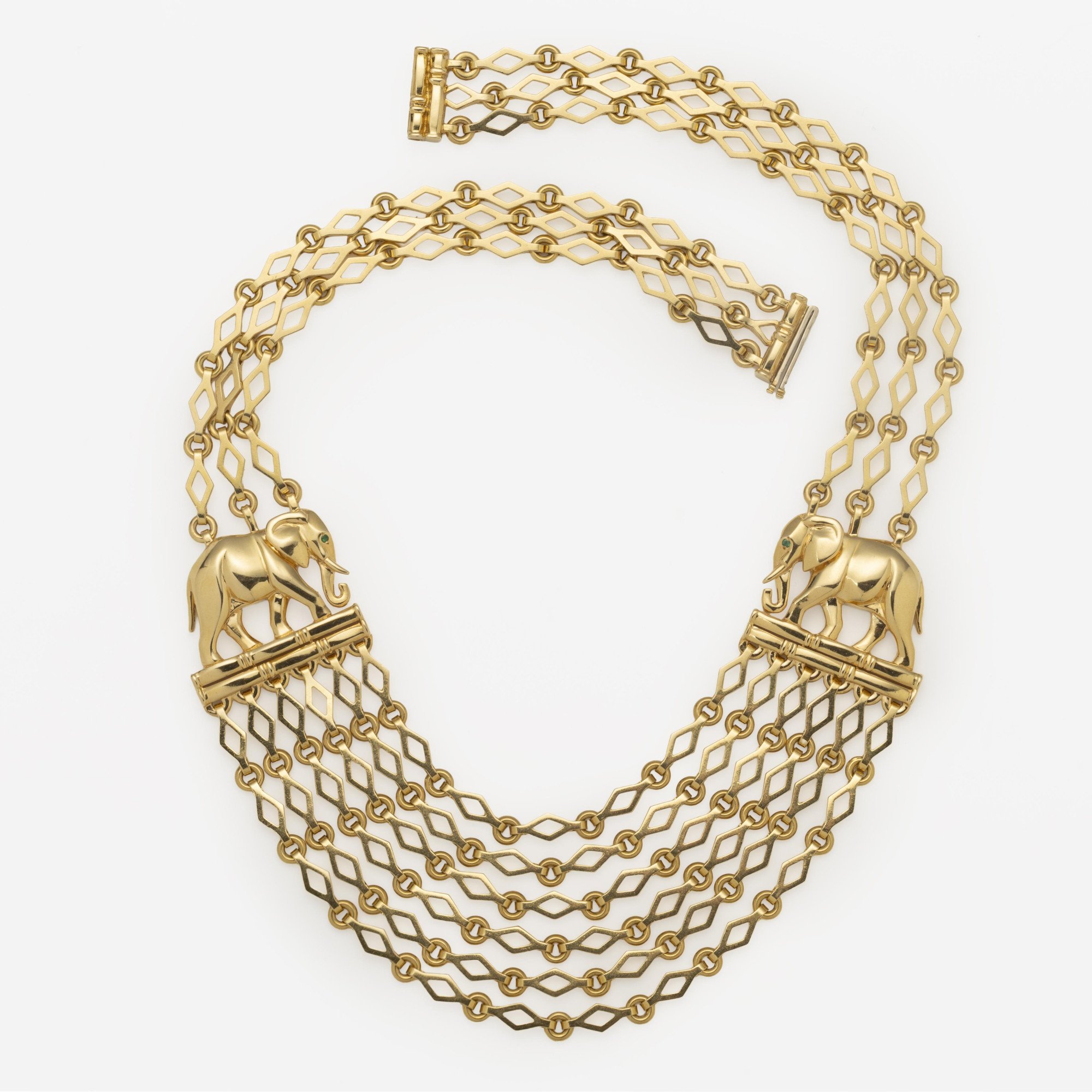 An eighteen carat yellow gold “Djigar” necklace, with two stylized elephants. Signed Cartier, Paris, circa 1995. Numbered and in original fold-over case.