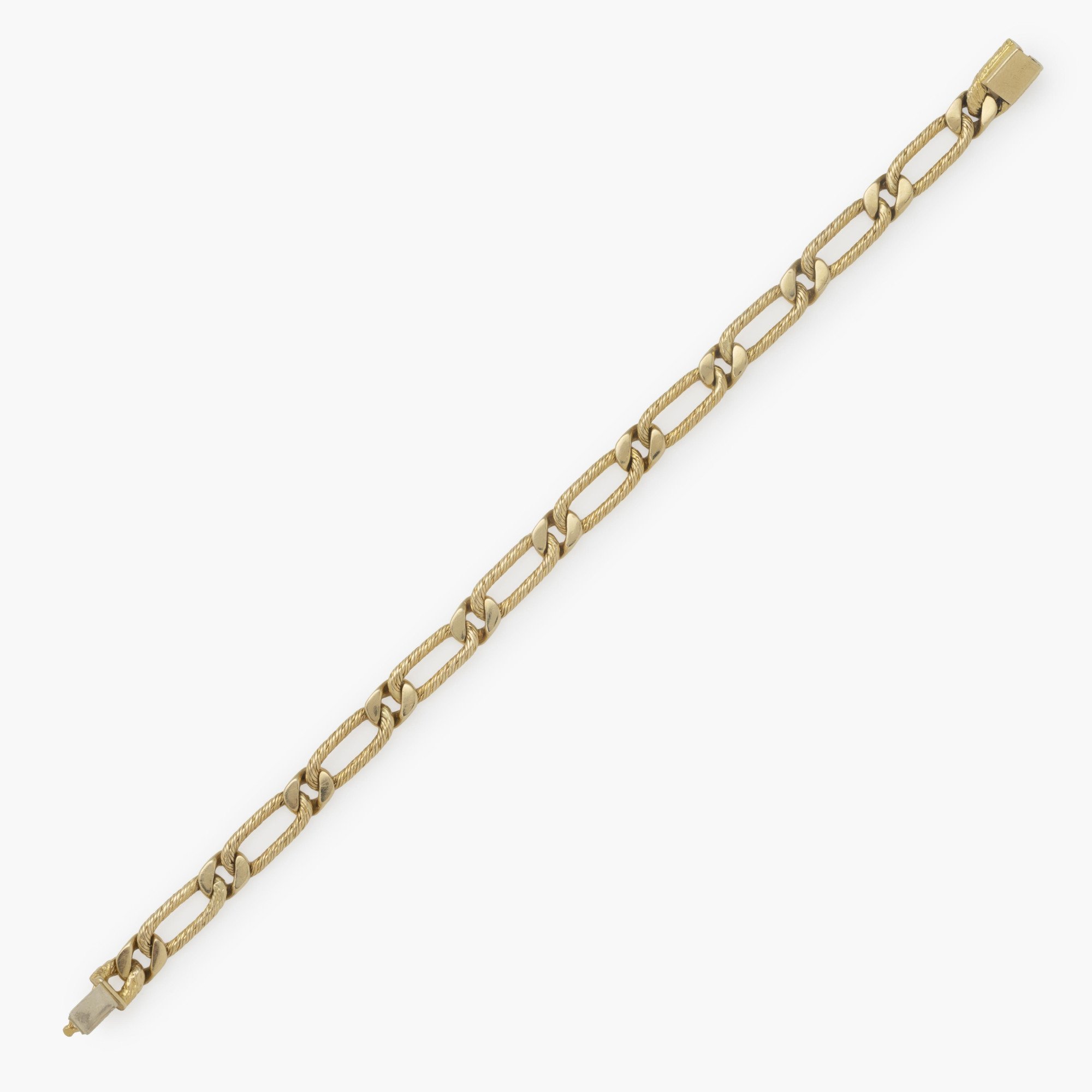 An eighteen-karat yellow gold bracelet of figaro link design. Signed Fred, Paris, made ca 1970. With maker’s mark of Georges Lenfant, Paris.