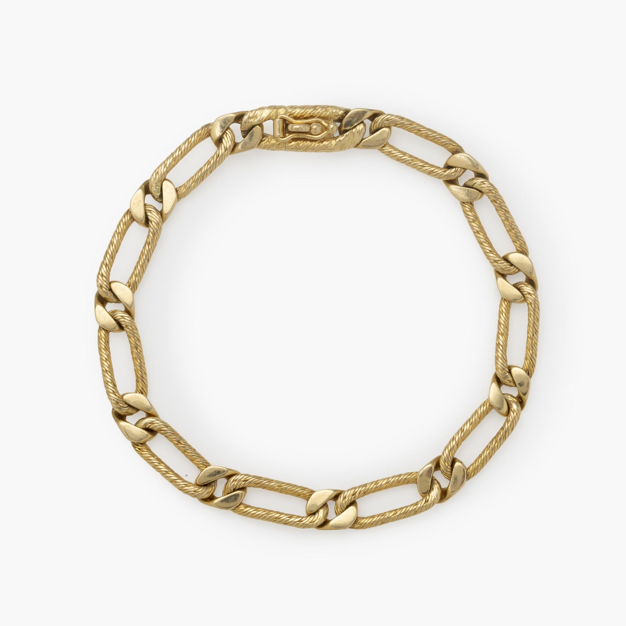 An eighteen-karat yellow gold bracelet of figaro link design. Signed Fred, Paris, made ca 1970. With maker’s mark of Georges Lenfant, Paris.