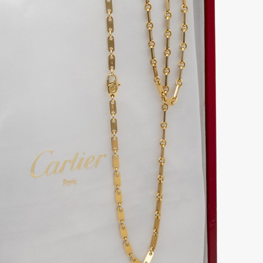 An eighteen carat yellow gold necklace ‘Fidelity’, signed Cartier, made ca 1990 and numbered. With original box.