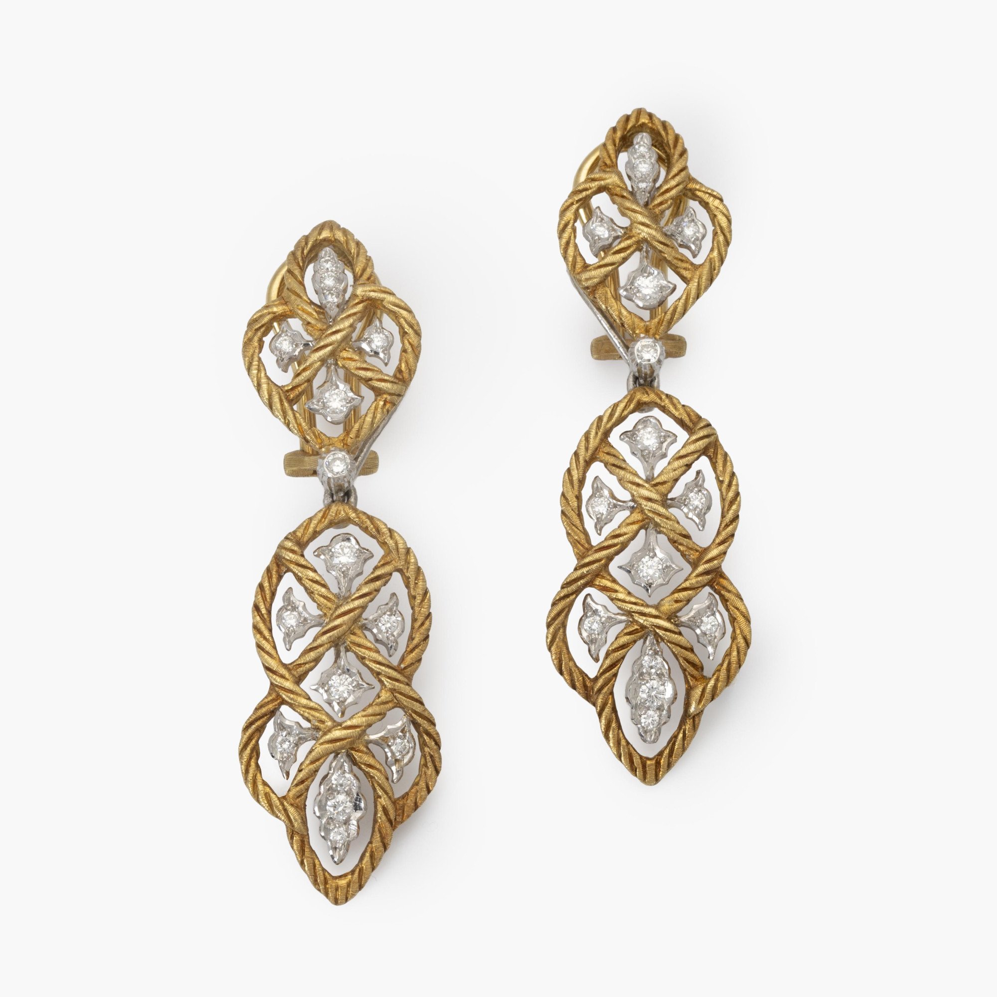 A pair of eighteen-carat yellow gold clip-earrings with detachable pendants, model ‘Étoilée’, set with diamonds. Signed Gianmaria Buccellati, Italy.