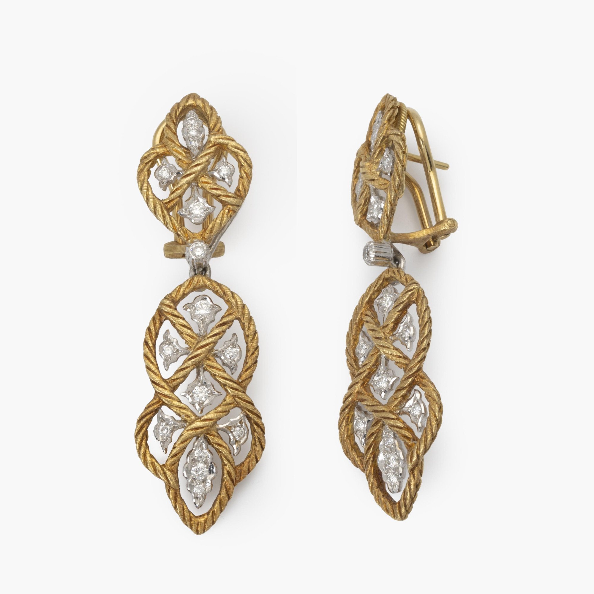 A pair of eighteen-carat yellow gold clip-earrings with detachable pendants, model ‘Étoilée’, set with diamonds. Signed Gianmaria Buccellati, Italy.
