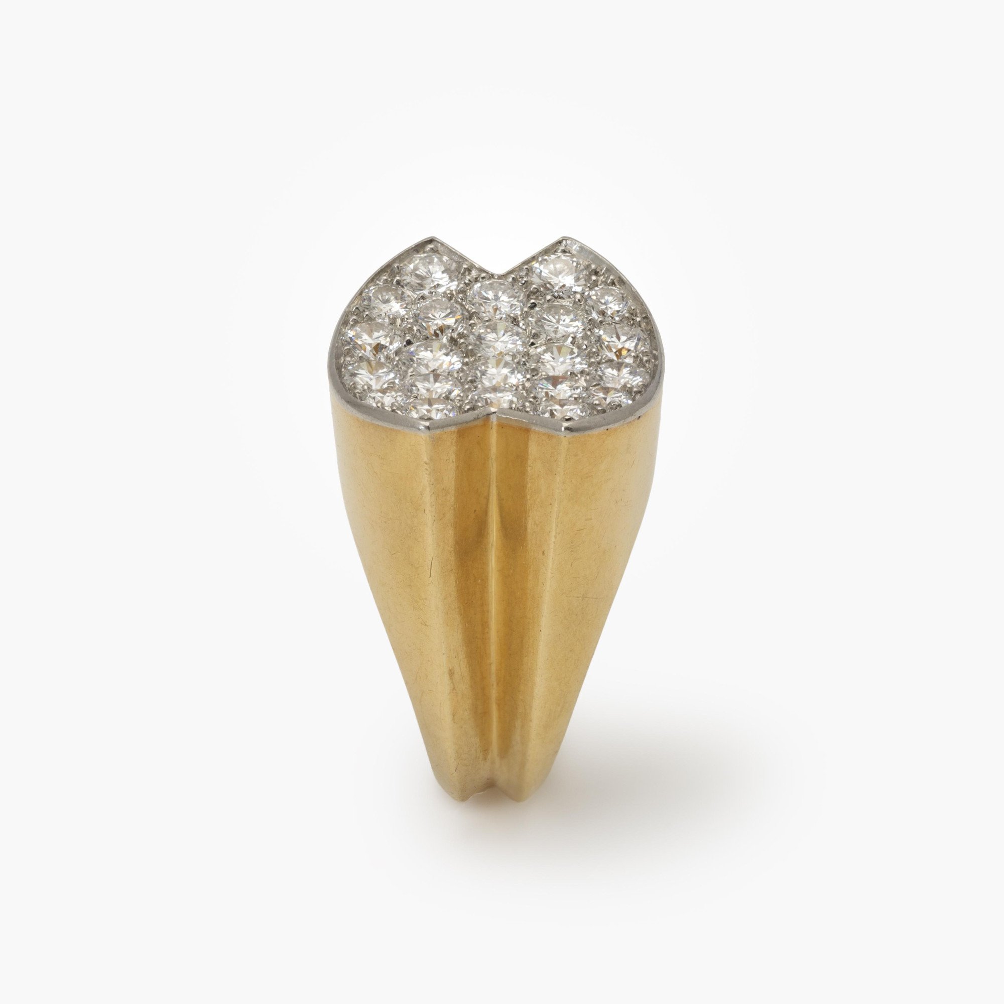 An eighteen-carat yellow gold ring, with a concave platinum top, set with brilliant-cut diamonds. Signed Cartier Paris and numbered. Made ca 1960.