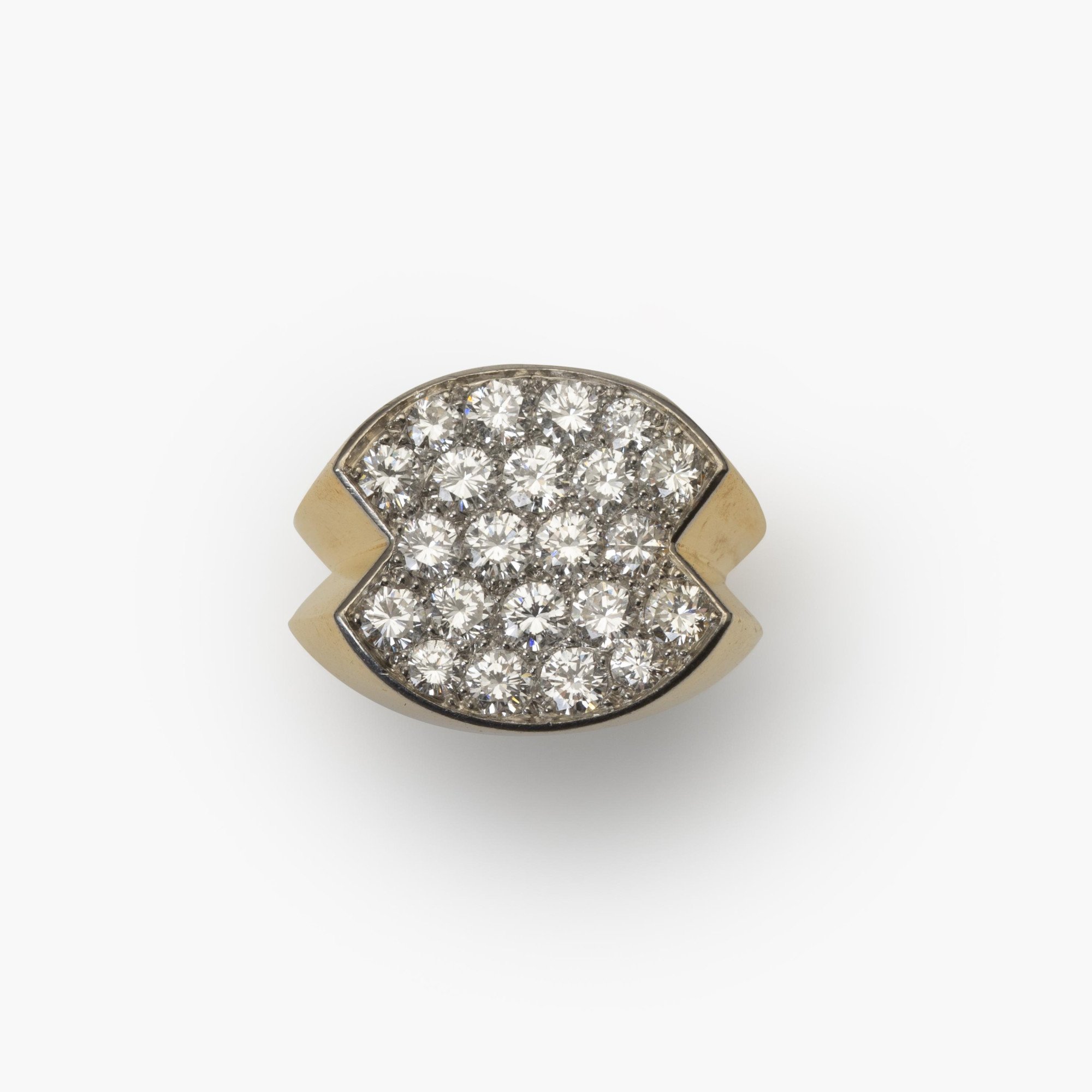 An eighteen-carat yellow gold ring, with a concave platinum top, set with brilliant-cut diamonds. Signed Cartier Paris and numbered. Made ca 1960.