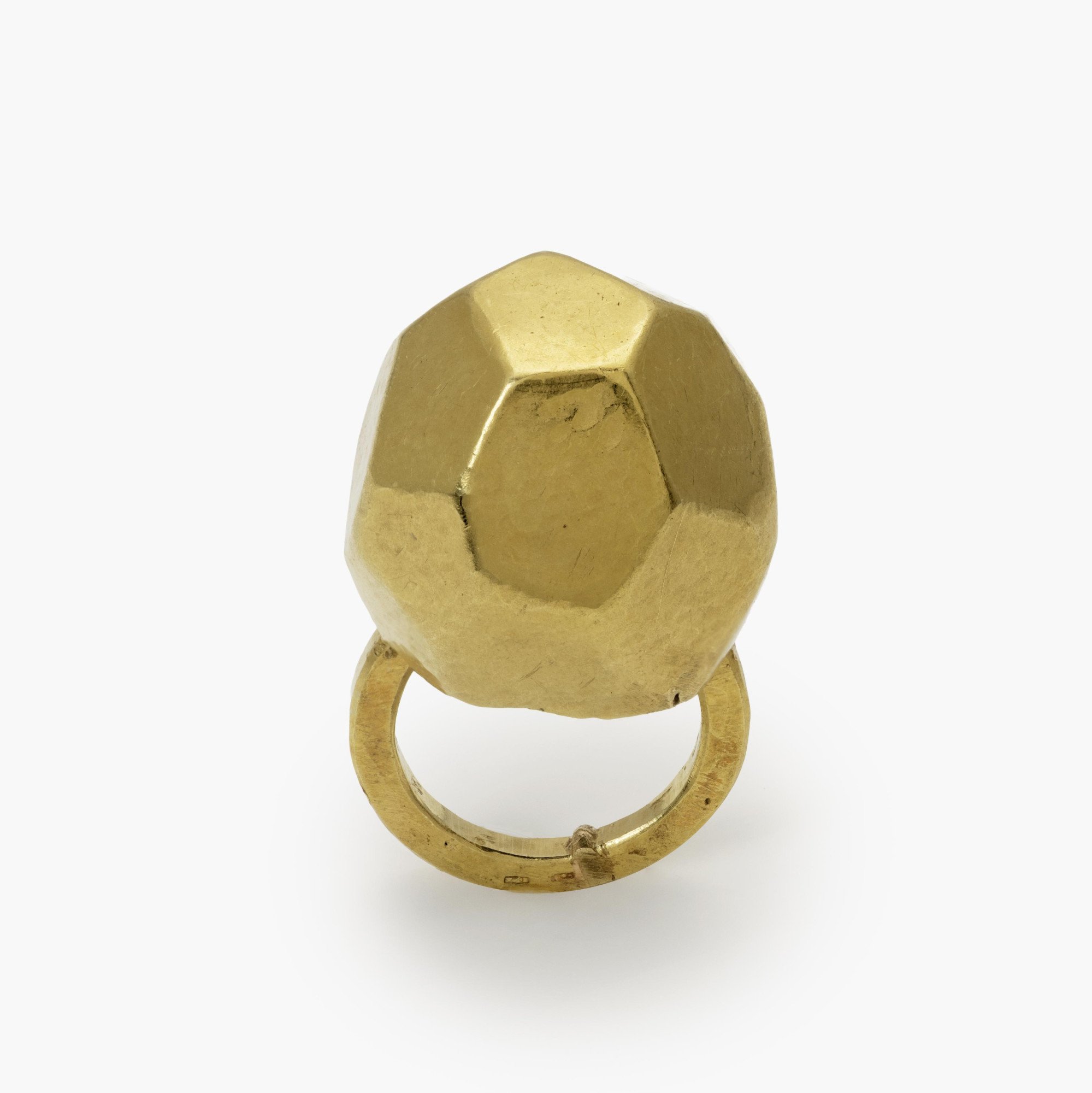 An eighteen carat yellow gold ring with an angular high dome, blue piment to the inside of the dome. Signed G. Babetto, Padova, Italy, dated 2005.