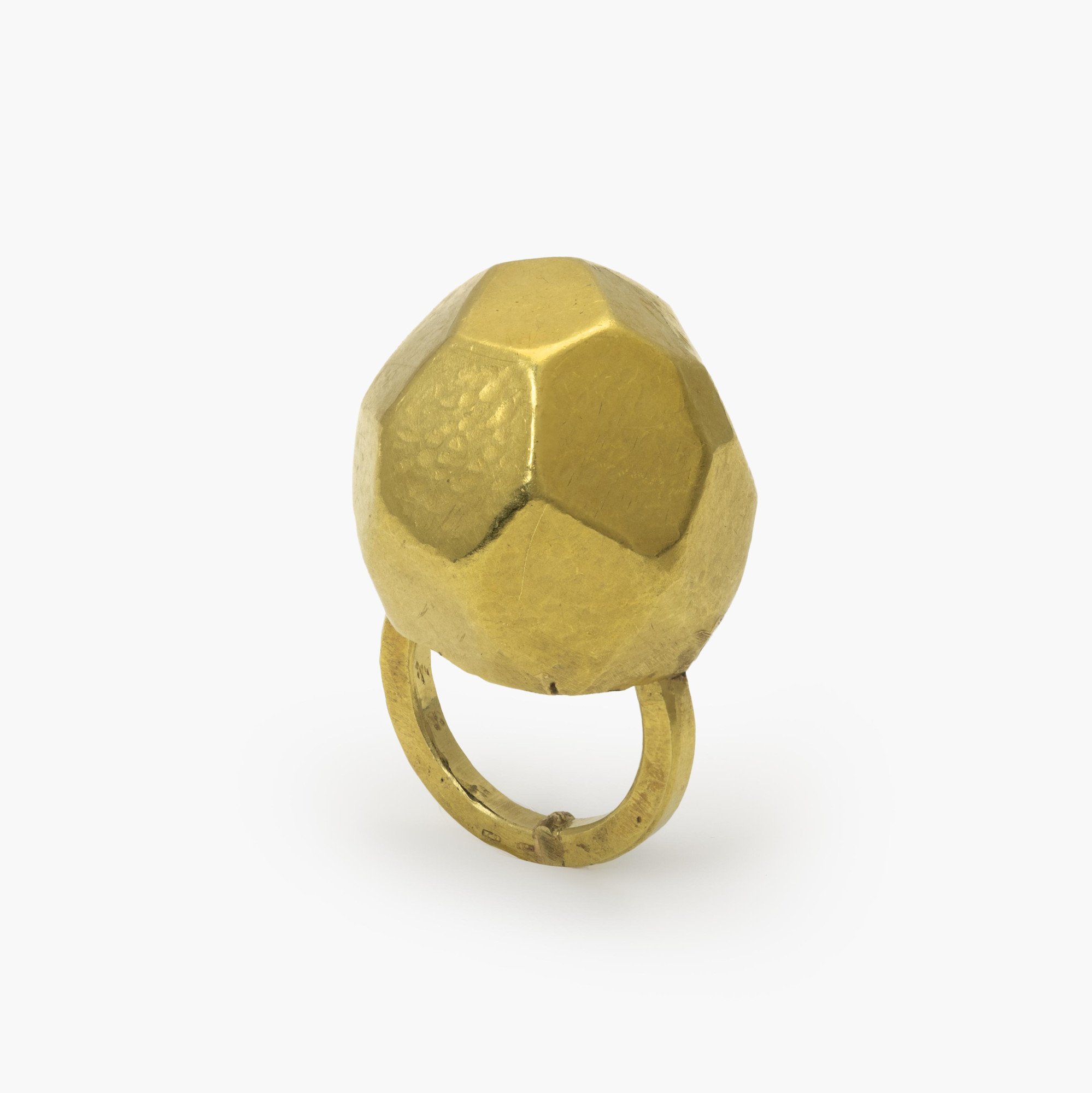 An eighteen carat yellow gold ring with an angular high dome, blue piment to the inside of the dome. Signed G. Babetto, Padova, Italy, dated 2005.
