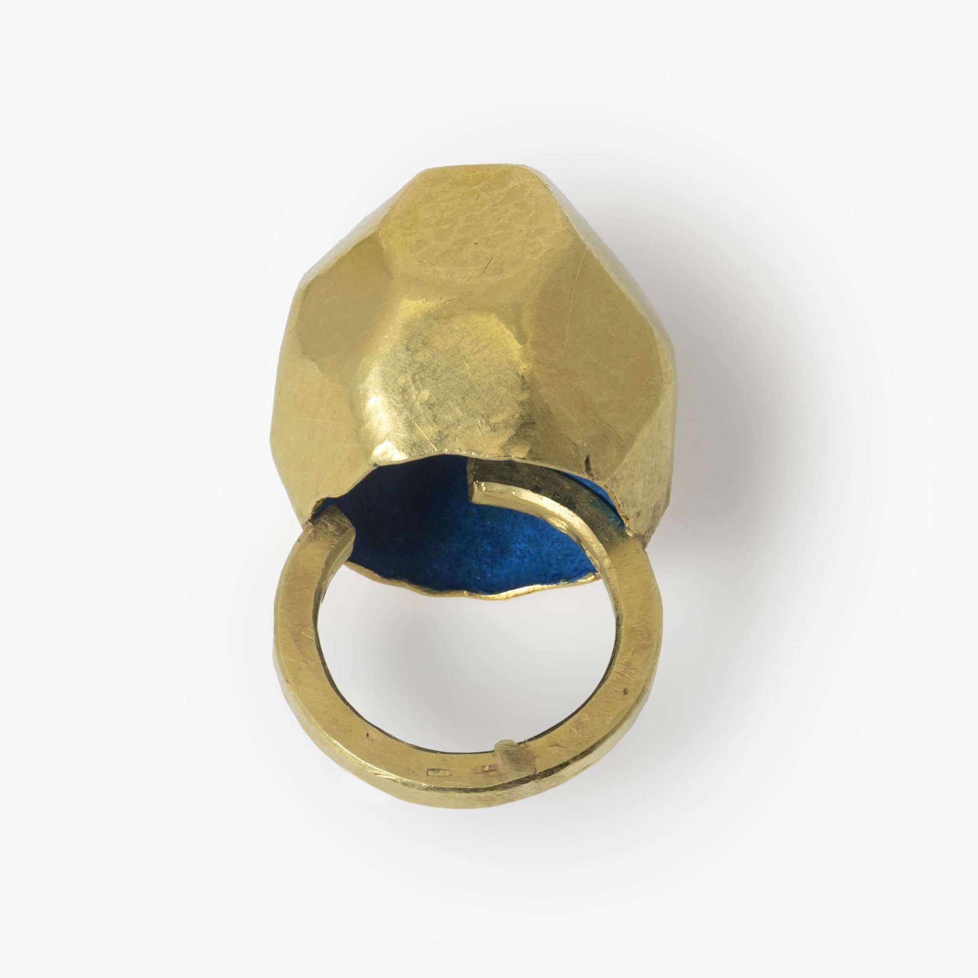 An eighteen carat yellow gold ring with an angular high dome, blue piment to the inside of the dome. Signed G. Babetto, Padova, Italy, dated 2005.