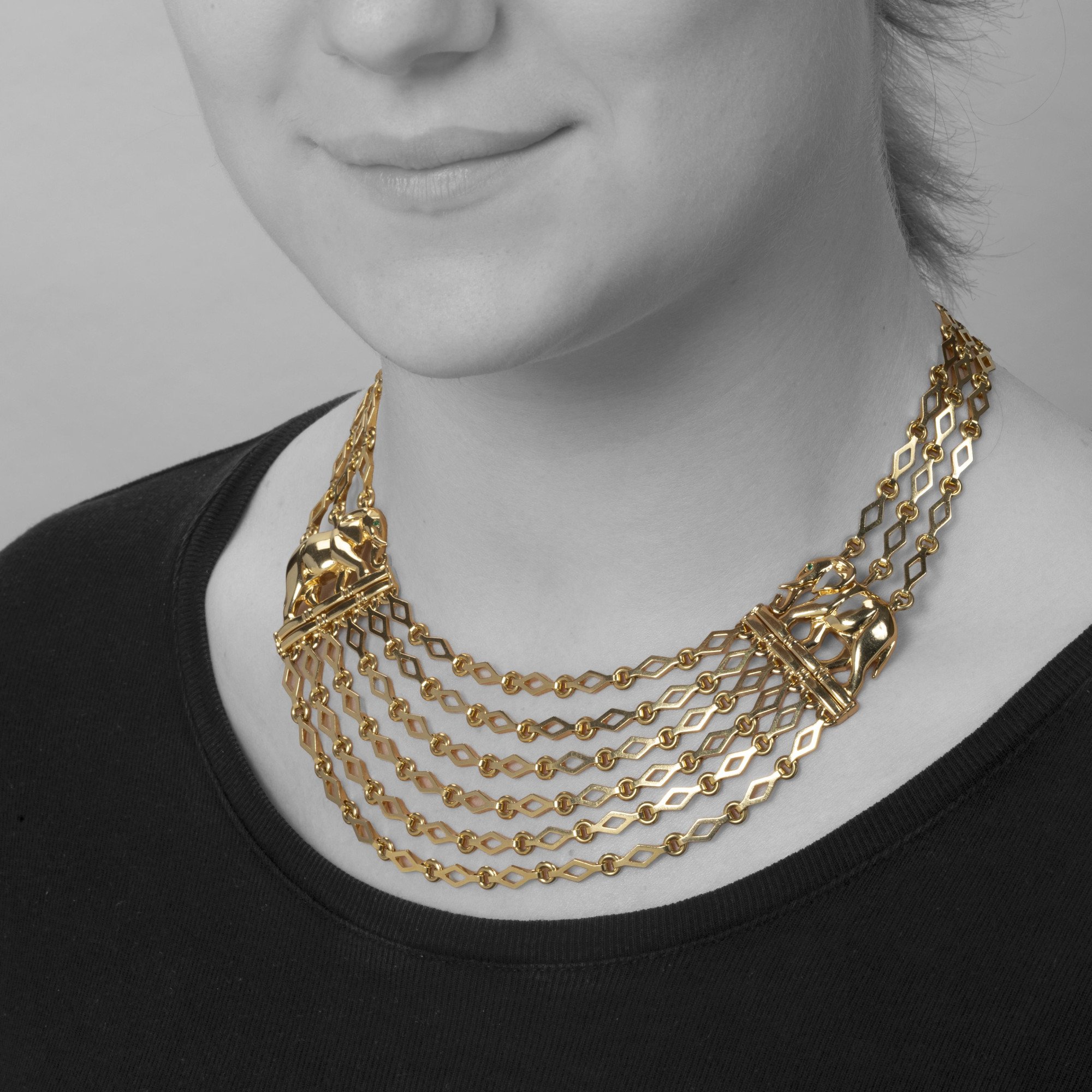 An eighteen carat yellow gold “Djigar” necklace, with two stylized elephants. Signed Cartier, Paris, circa 1995. Numbered and in original fold-over case.