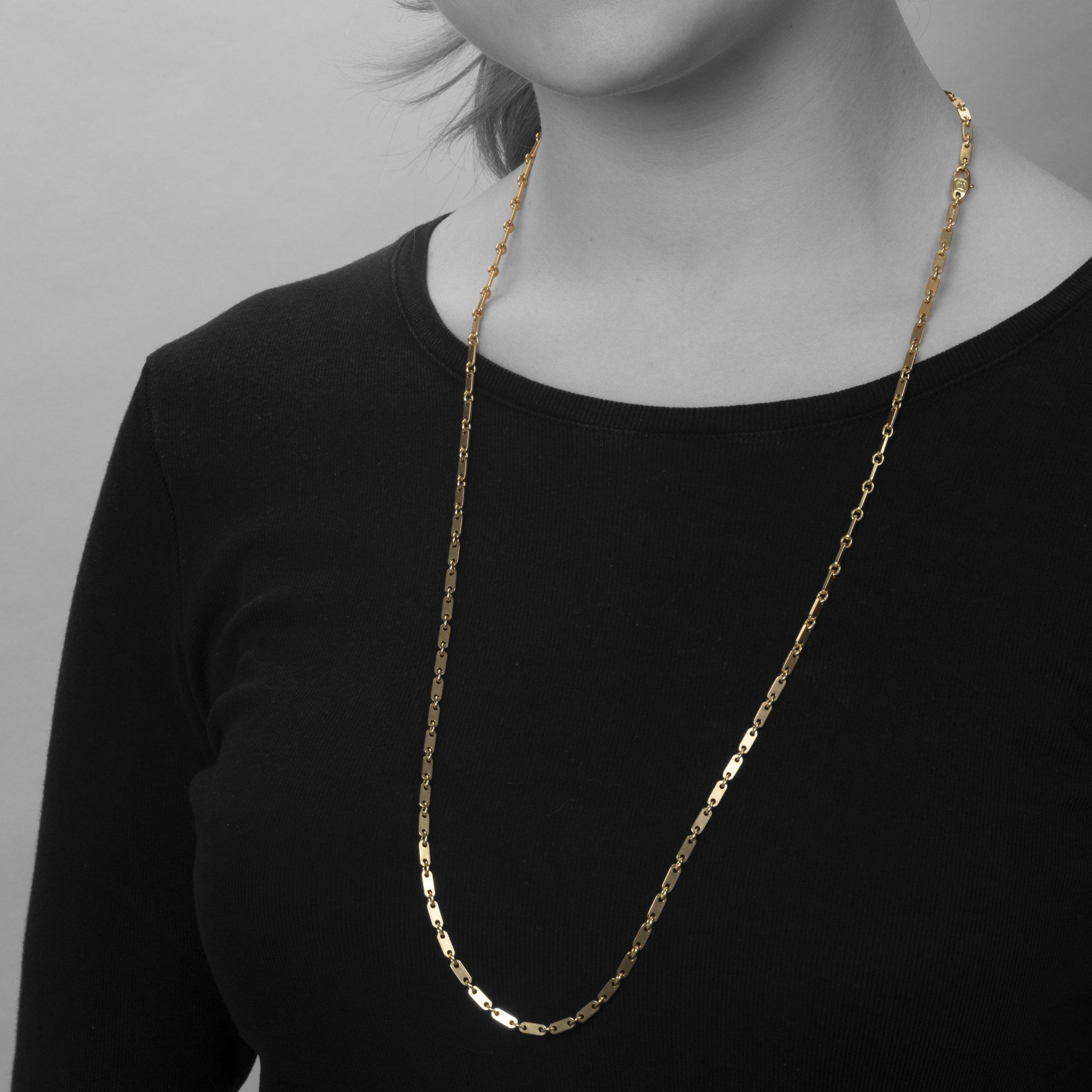 An eighteen carat yellow gold necklace ‘Fidelity’, signed Cartier, made ca 1990 and numbered. With original box.
