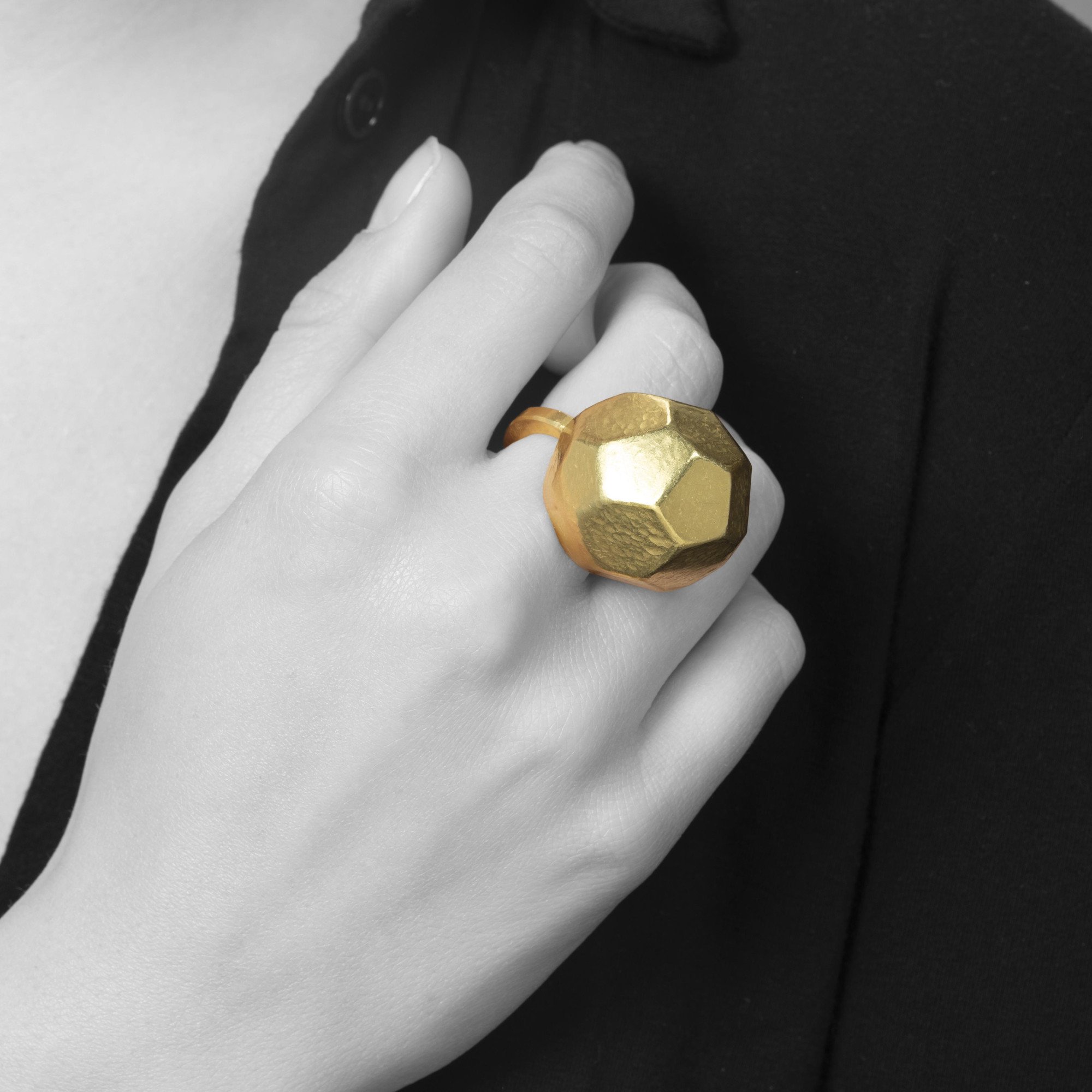 An eighteen carat yellow gold ring with an angular high dome, blue piment to the inside of the dome. Signed G. Babetto, Padova, Italy, dated 2005.