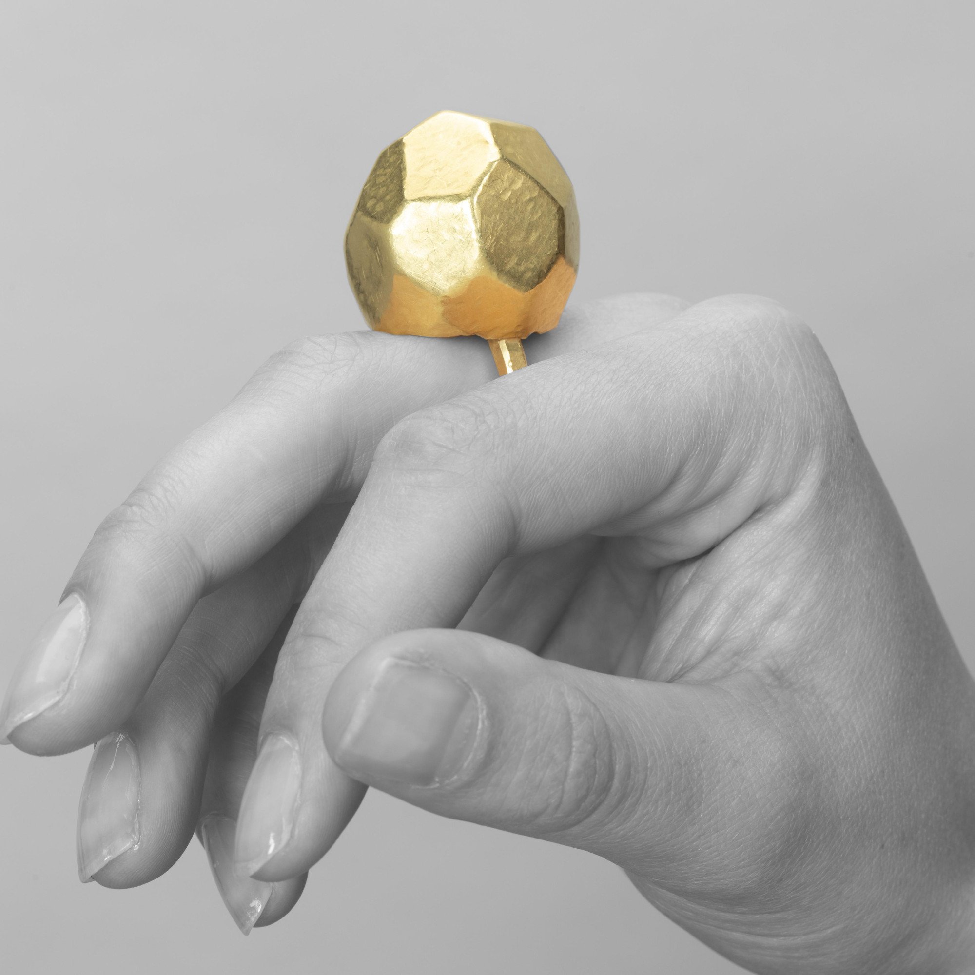 An eighteen carat yellow gold ring with an angular high dome, blue piment to the inside of the dome. Signed G. Babetto, Padova, Italy, dated 2005.