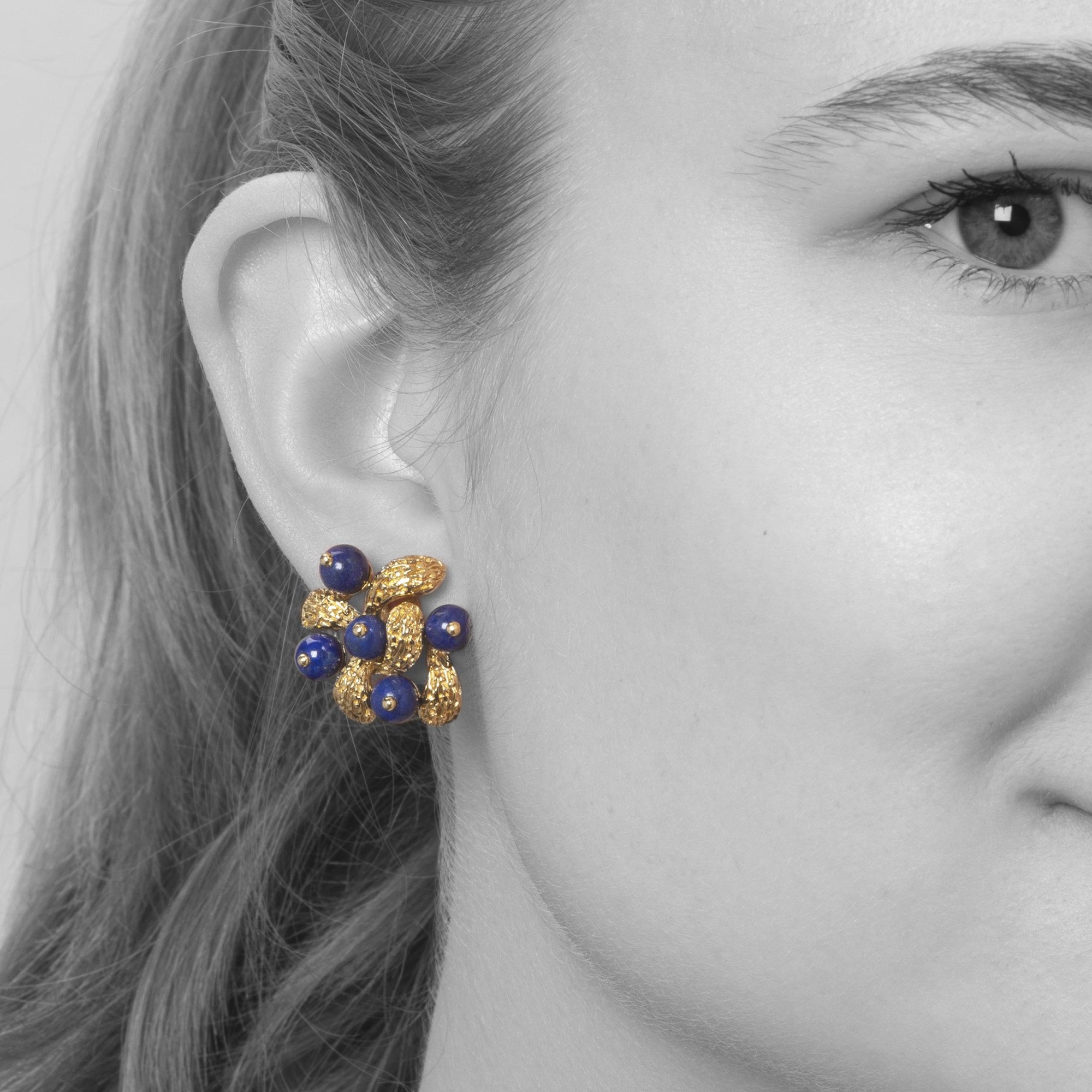 A pair of eighteen-carat yellow gold clip earrings, set with lapis lazuli beads, signed Van Cleef & Arpels, Paris, numbered and dated 1967.