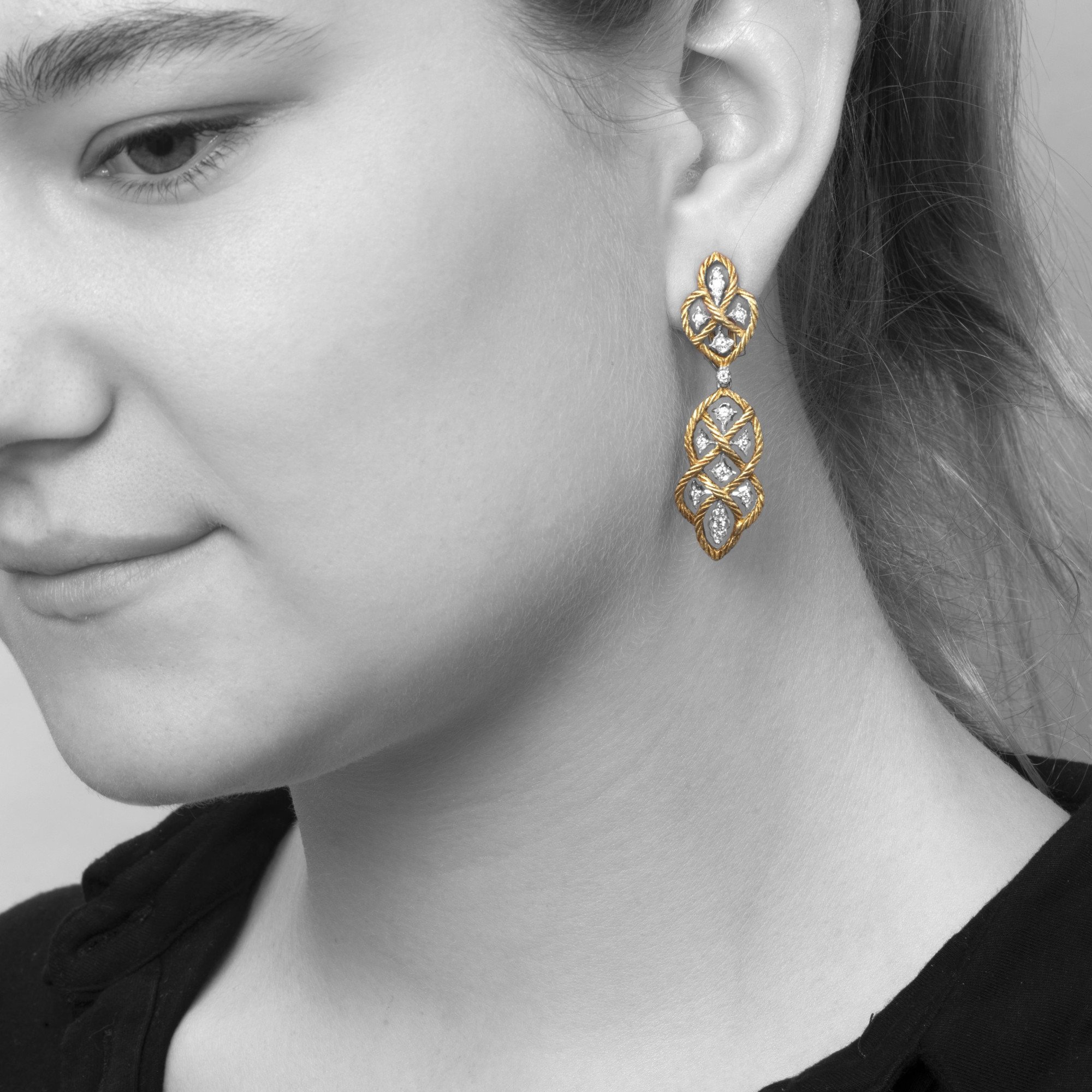 A pair of eighteen-carat yellow gold clip-earrings with detachable pendants, model ‘Étoilée’, set with diamonds. Signed Gianmaria Buccellati, Italy.