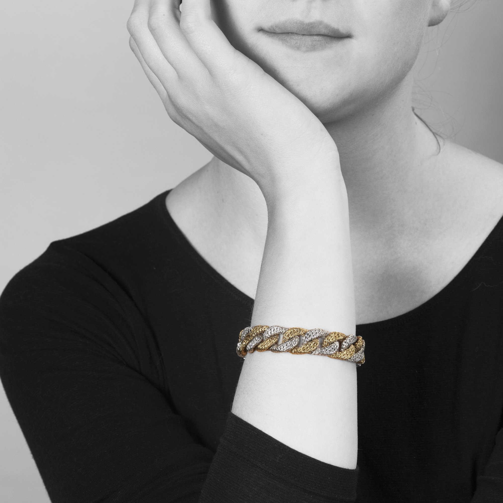 An eighteen carat white and yellow gold curb link bracelet. With maker’s mark of George Lenfant, Paris. Made circa 1970.