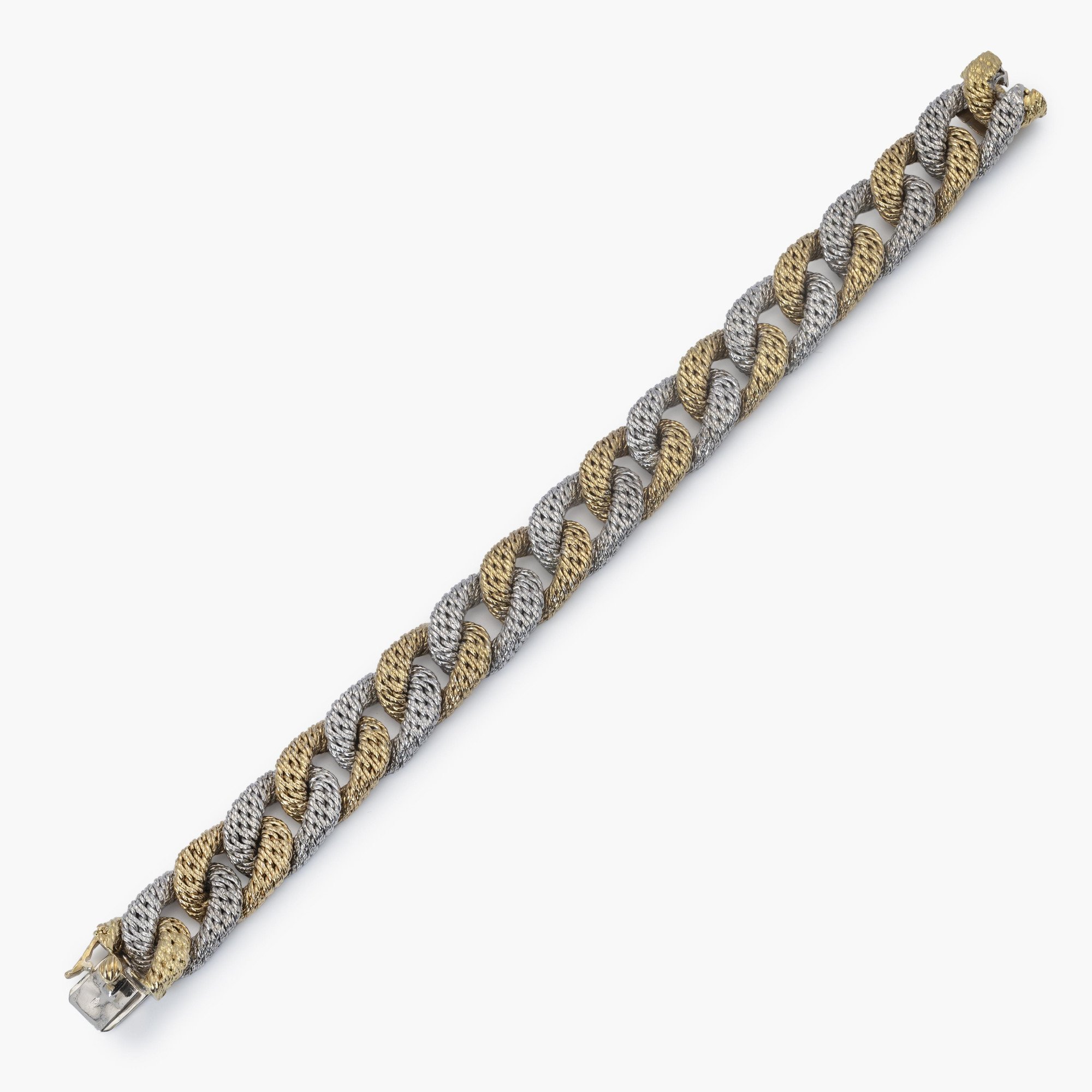 An eighteen carat white and yellow gold curb link bracelet. With maker’s mark of George Lenfant, Paris. Made circa 1970.