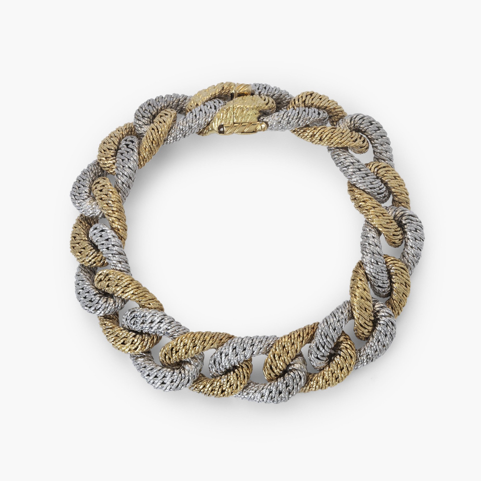 An eighteen carat white and yellow gold curb link bracelet. With maker’s mark of George Lenfant, Paris. Made circa 1970.