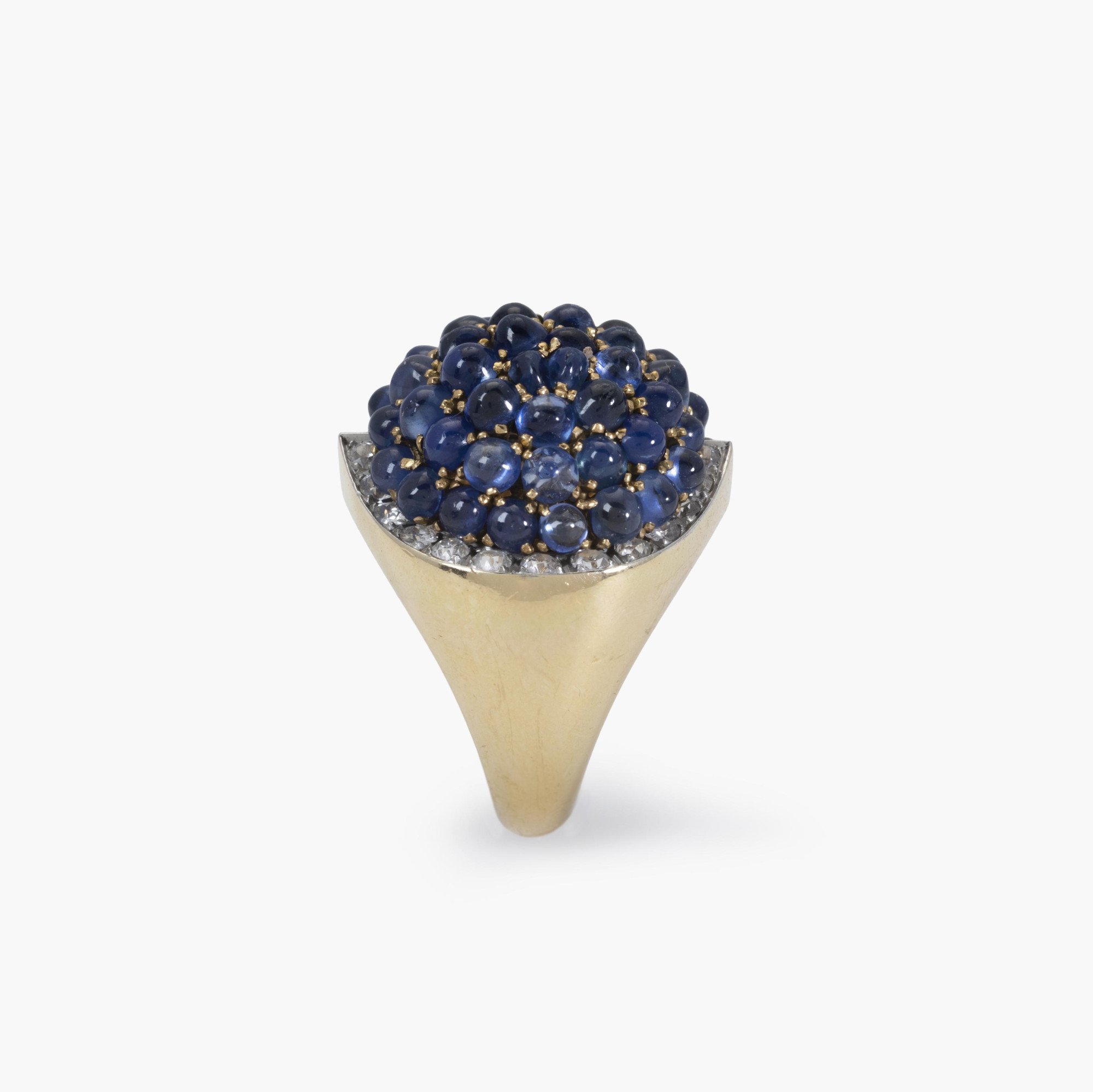 An eighteen carat yellow gold and platinum ring, pavé set with sapphires, surrounded by brilliant-cut diamonds. Signed Van Cleef & Arpels and numbered.