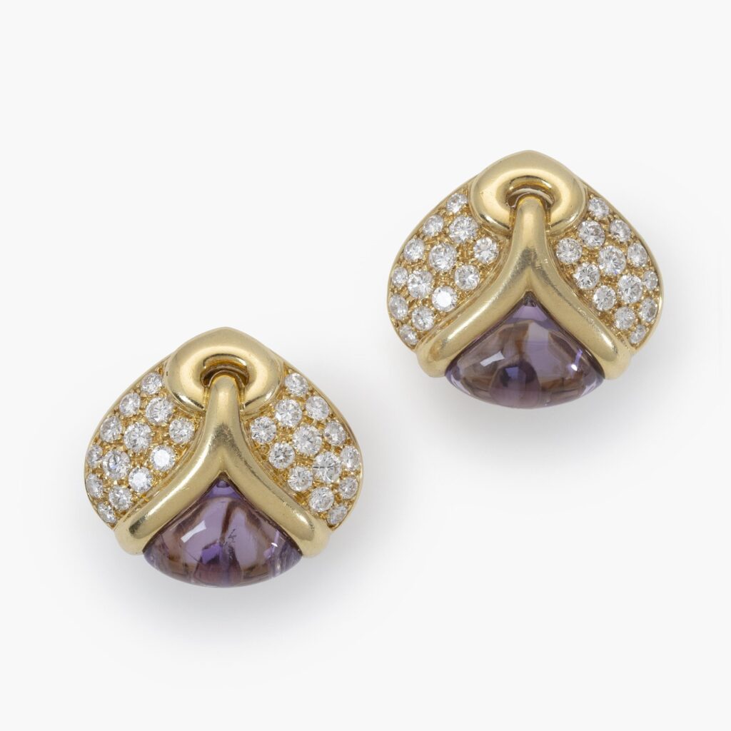 A pair of eighteen carat yellow gold clip earrings, each set with amethyst and diamonds. Signed Bvlgari, made in Rome, Italy and dated 1989.