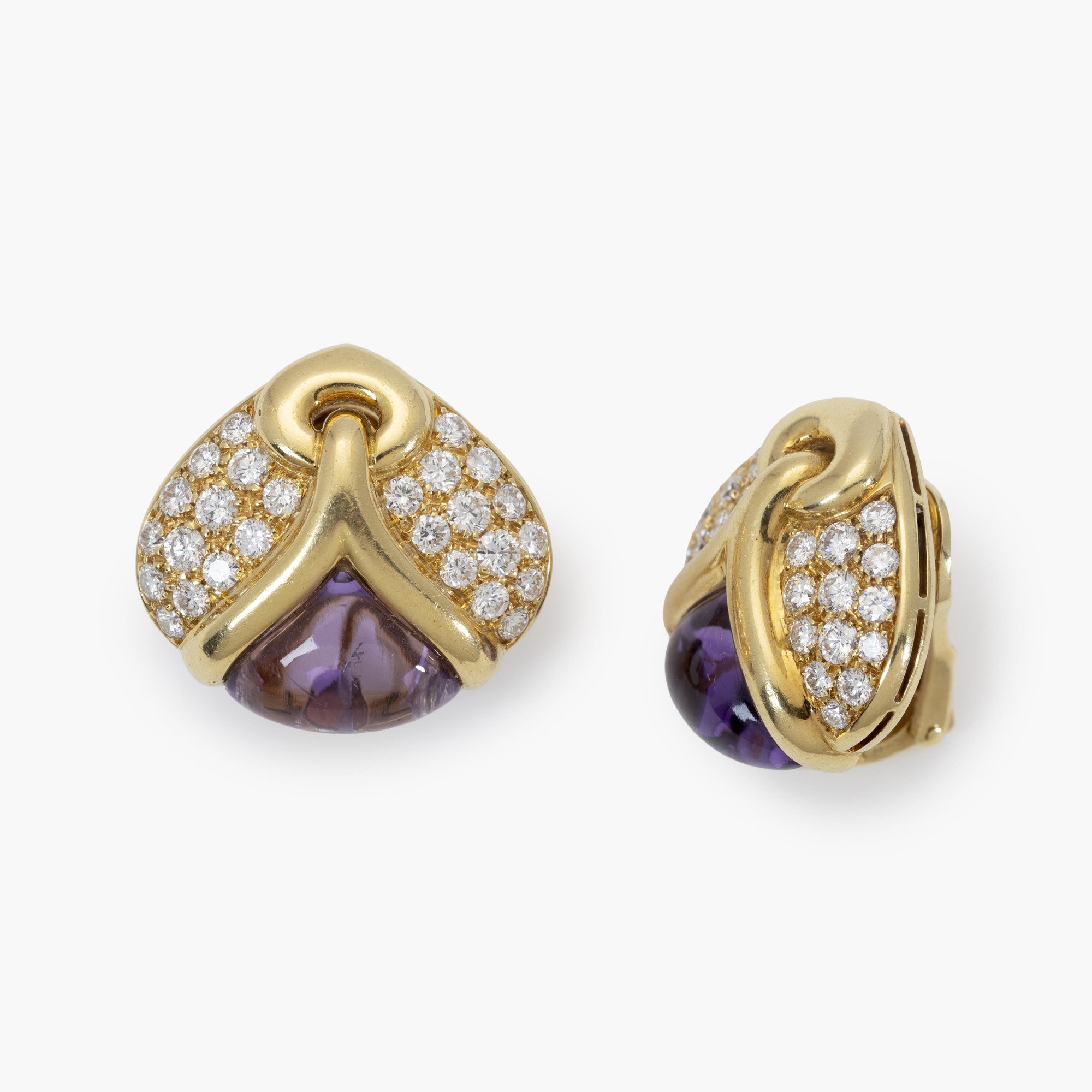 A pair of eighteen carat yellow gold clip earrings, each set with amethyst and diamonds. Signed Bvlgari, made in Rome, Italy and dated 1989.