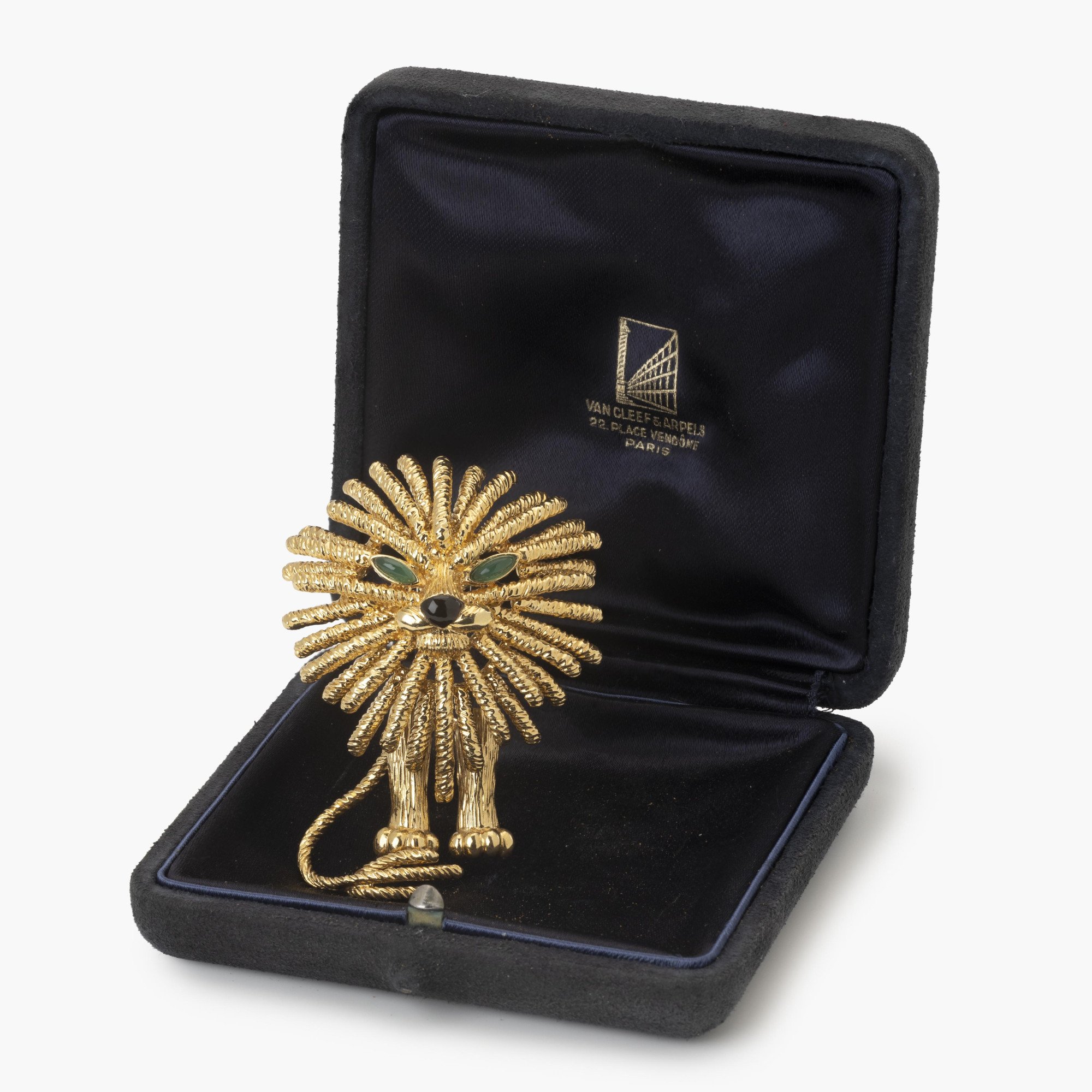An eighteen-carat yellow gold brooch depicting a lion. Signed Van Cleef & Arpels, made in Paris, dated 1972 and numbered. In original case.