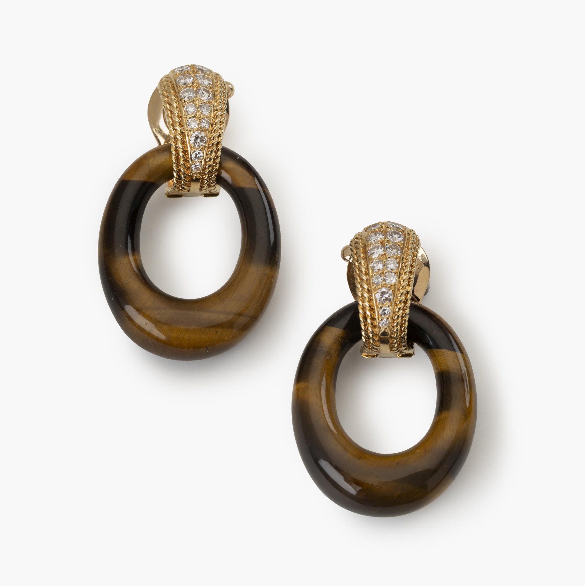 A pair of eighteen carat yellow gold clip earrings set with brilliant cut diamonds. Signed Van Cleef & Arpels, Paris,1971. With four pairs of rings.