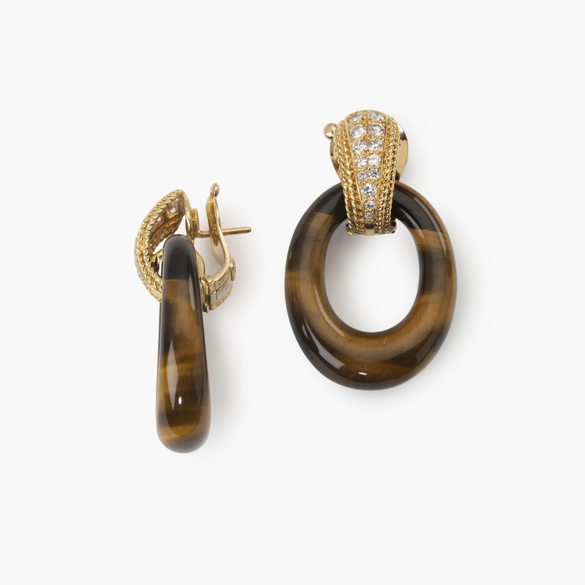 A pair of eighteen carat yellow gold clip earrings set with brilliant cut diamonds. Signed Van Cleef & Arpels, Paris,1971. With four pairs of rings.