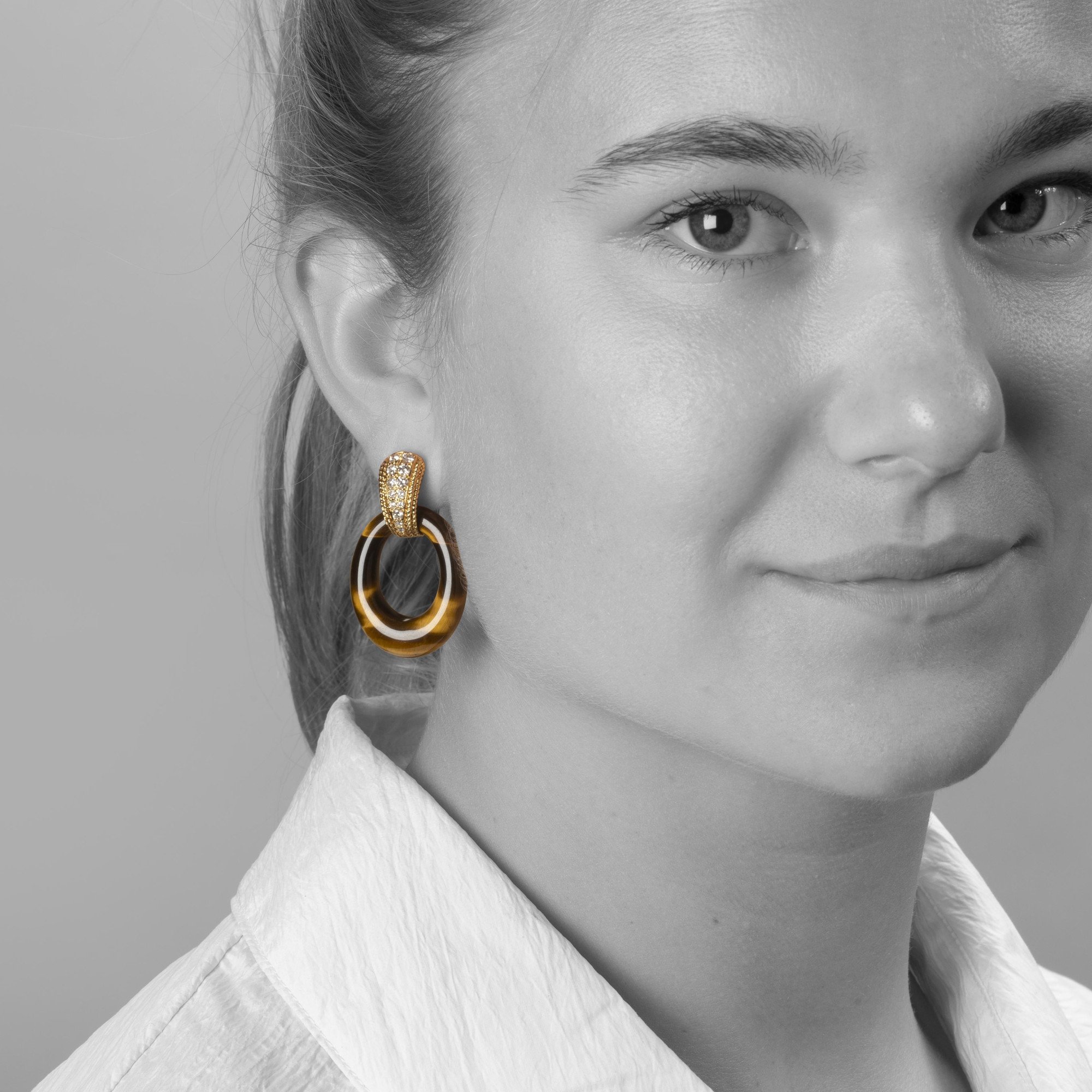 A pair of eighteen carat yellow gold clip earrings set with brilliant cut diamonds. Signed Van Cleef & Arpels, Paris,1971. With four pairs of rings.