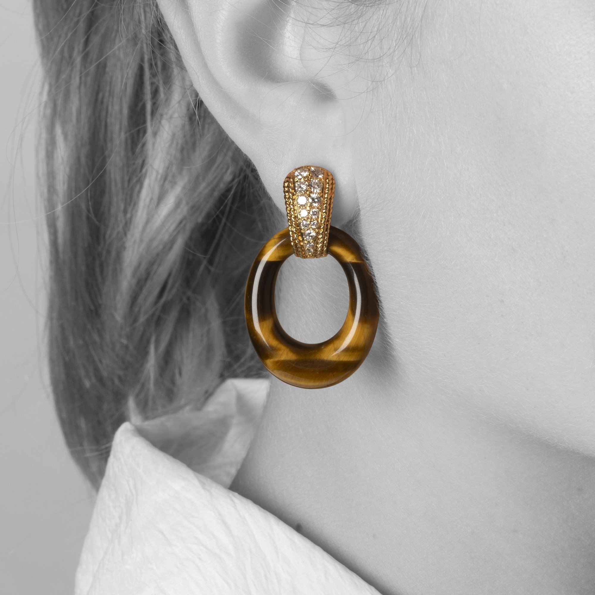A pair of eighteen carat yellow gold clip earrings set with brilliant cut diamonds. Signed Van Cleef & Arpels, Paris,1971. With four pairs of rings.