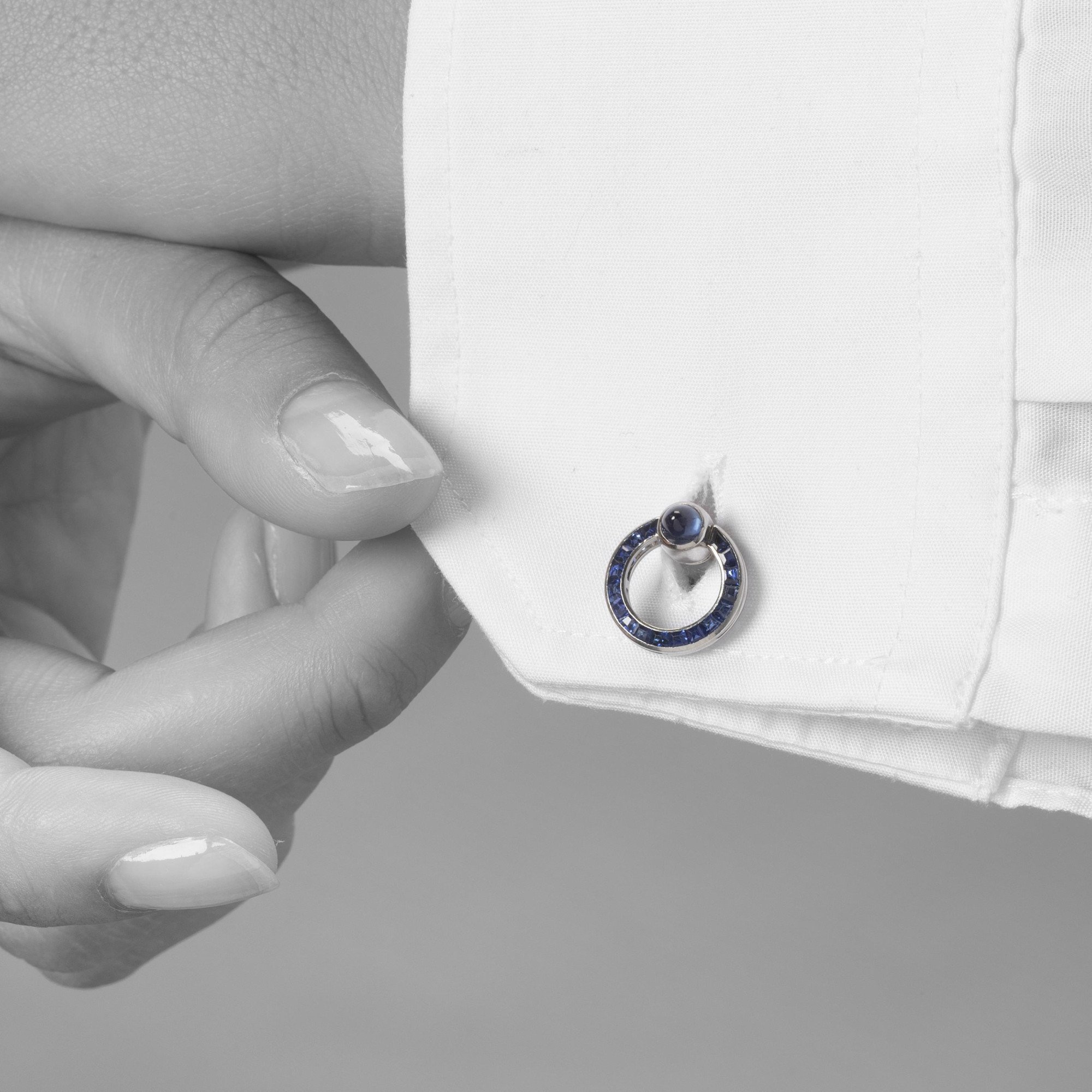 A pair of platinum Art Deco cufflinks, set with sapphires and diamonds. Signed Cartier Paris-made in France and numbered. Made ca 1925. In original case.